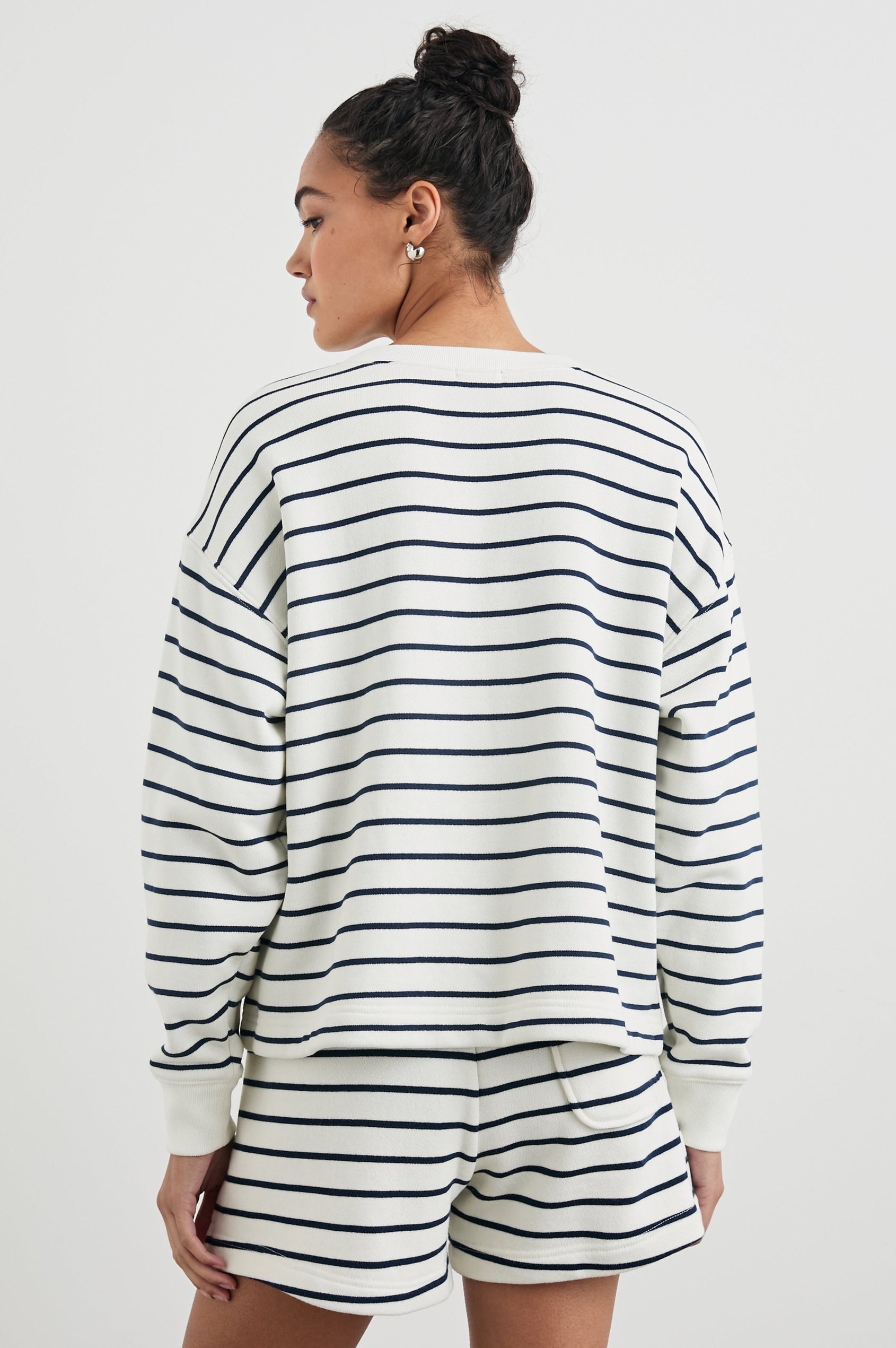 Joan Long-Sleeve Sweatshirt with Buttons to the Mid-Torso and Cuffed sleeves in Sailor Stripe Navy Colorway, horizontal stripes on white - Back View Featured on Model