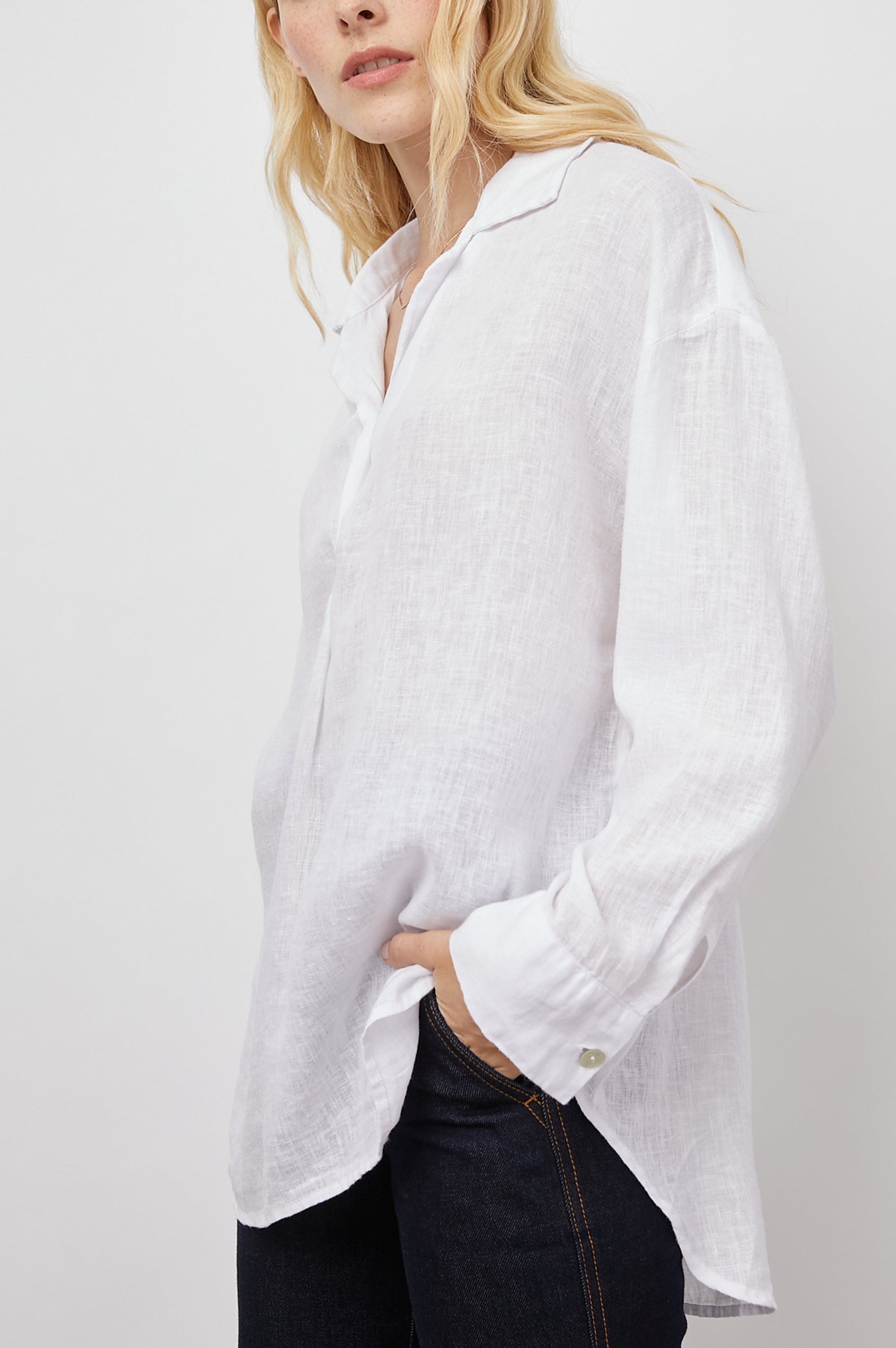 Jocelyn Long-Sleeve Shirt with Button Cuffs, a Collar and a V Neck with a Half-Sealed Placket in White Colorway - Side View Featured on Model 