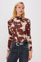 Joelle Long Sleeve Top with An Asymmetrical Mock Neck and Shirring on the Right Shoulder in Cowgirl Colorway - Front View Featured on Model