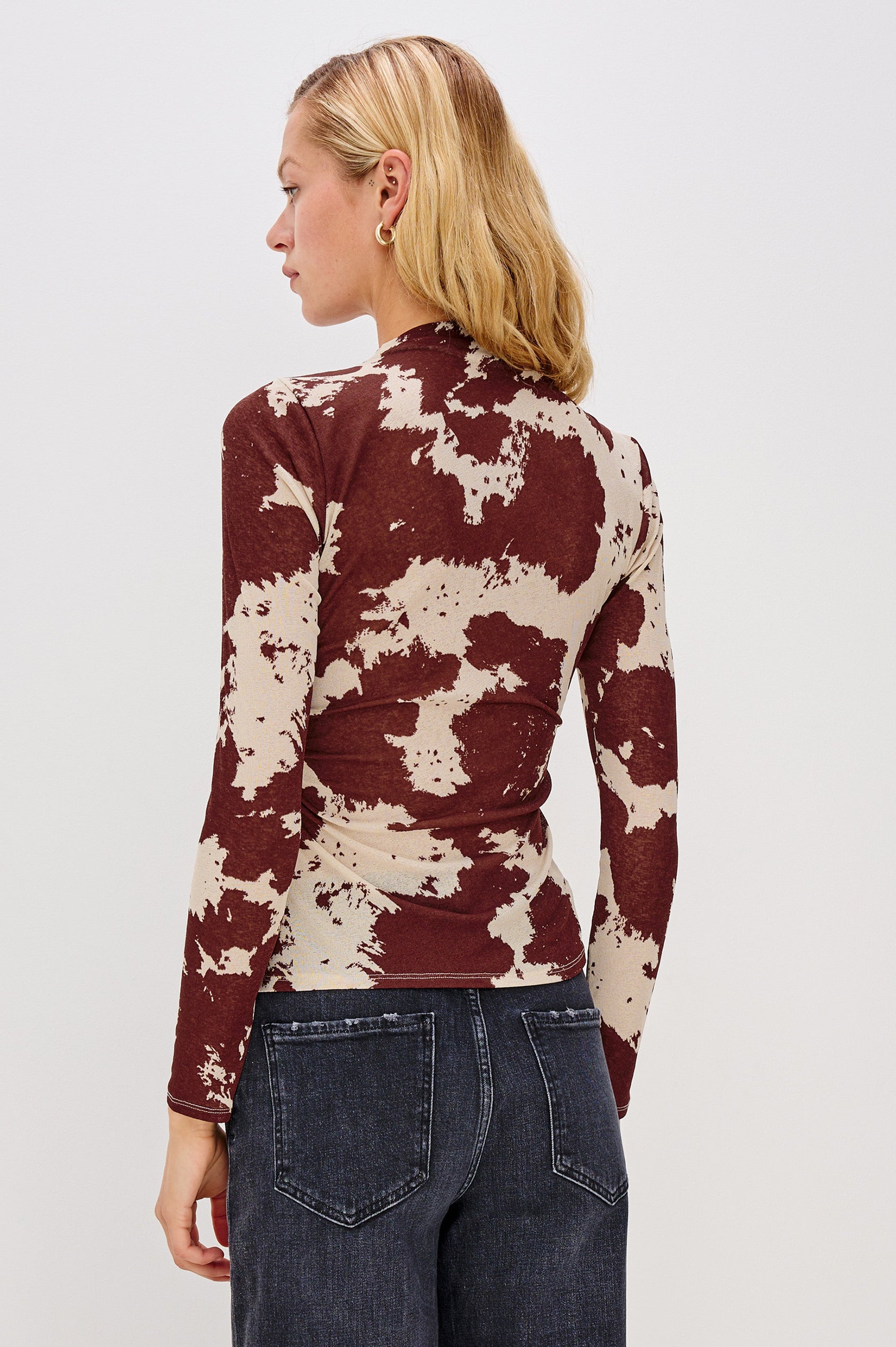 Joelle Long Sleeve Top with An Asymmetrical Mock Neck and Shirring on the Right Shoulder in Cowgirl Colorway - Back View Featured on Model