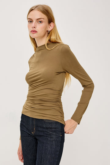 Joelle Long Sleeve Top with An Asymmetrical Mock Neck and Shirring on the Right Shoulder in Ivory Colorway - Front View Featured on Model