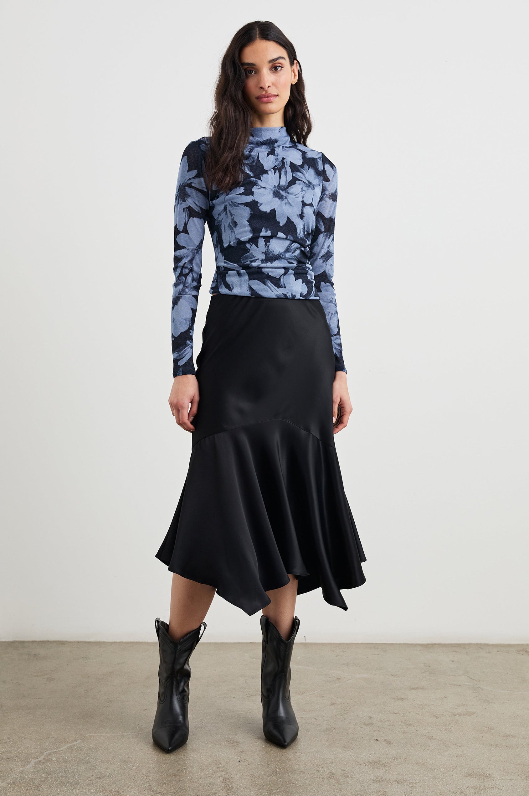 Joelle Long Sleeve Top with An Asymmetrical Mock Neck and Shirring on the Right Shoulder in Midnight Lily Colorway, with blue Lilies on Midnight - Front Full Body View Featured on Model