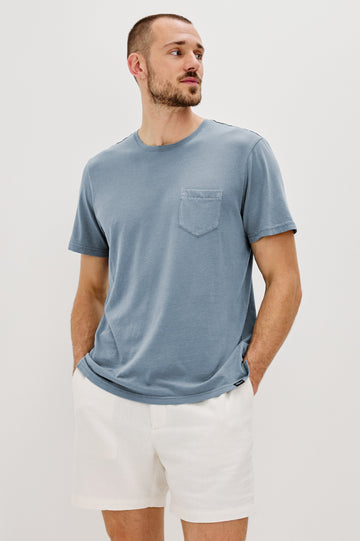 Johnny Short Sleeve T-Shirt with a Crew Neck, Chest Patch Pocket and Small Slits at the Side Hems in Steel Colorway - Front View Featured on Model