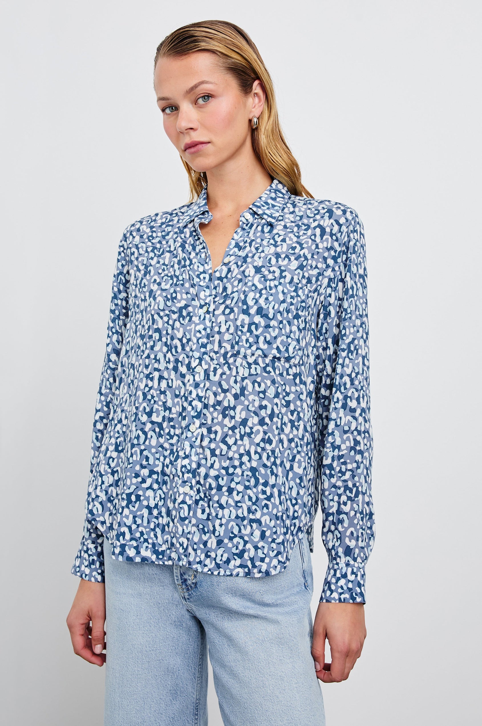 Josephine Long-Sleeve Button Down with a Chest Patch Pocket in Blue Mixed Cheetah Colorway, a cheetah pattern in blues and white - Front View Featured on Model