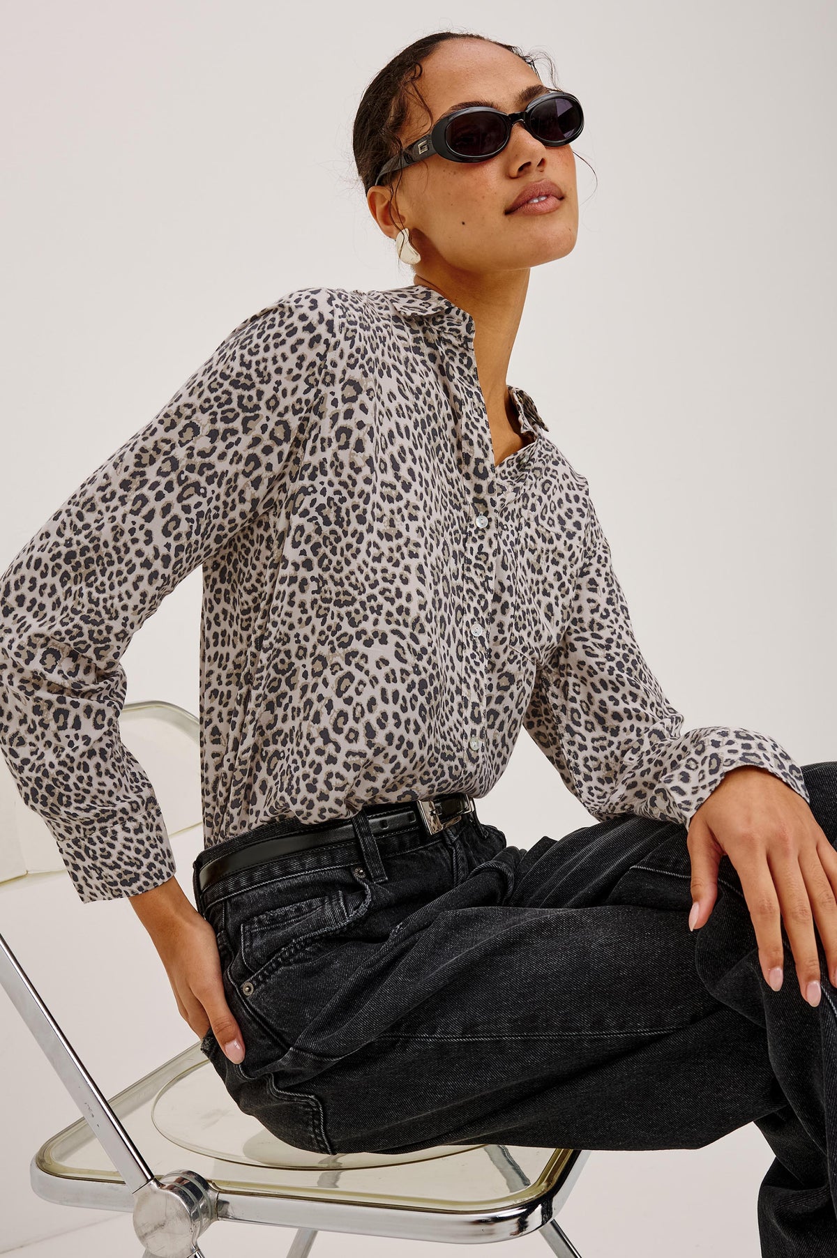 Josephine Shirt in Featherweight Rayon With Relaxed Fit, Collar, and Button Front in Ecru Cheetah Colorway - Upper Body Side View Featured on Model Sitting