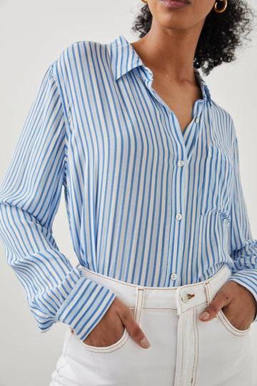 Josephine Long-Sleeve Button Down with a Chest Patch Pocket in Mar Stripe Colorway, vertical stripes in white and blues - Front Tucked View Featured on Model