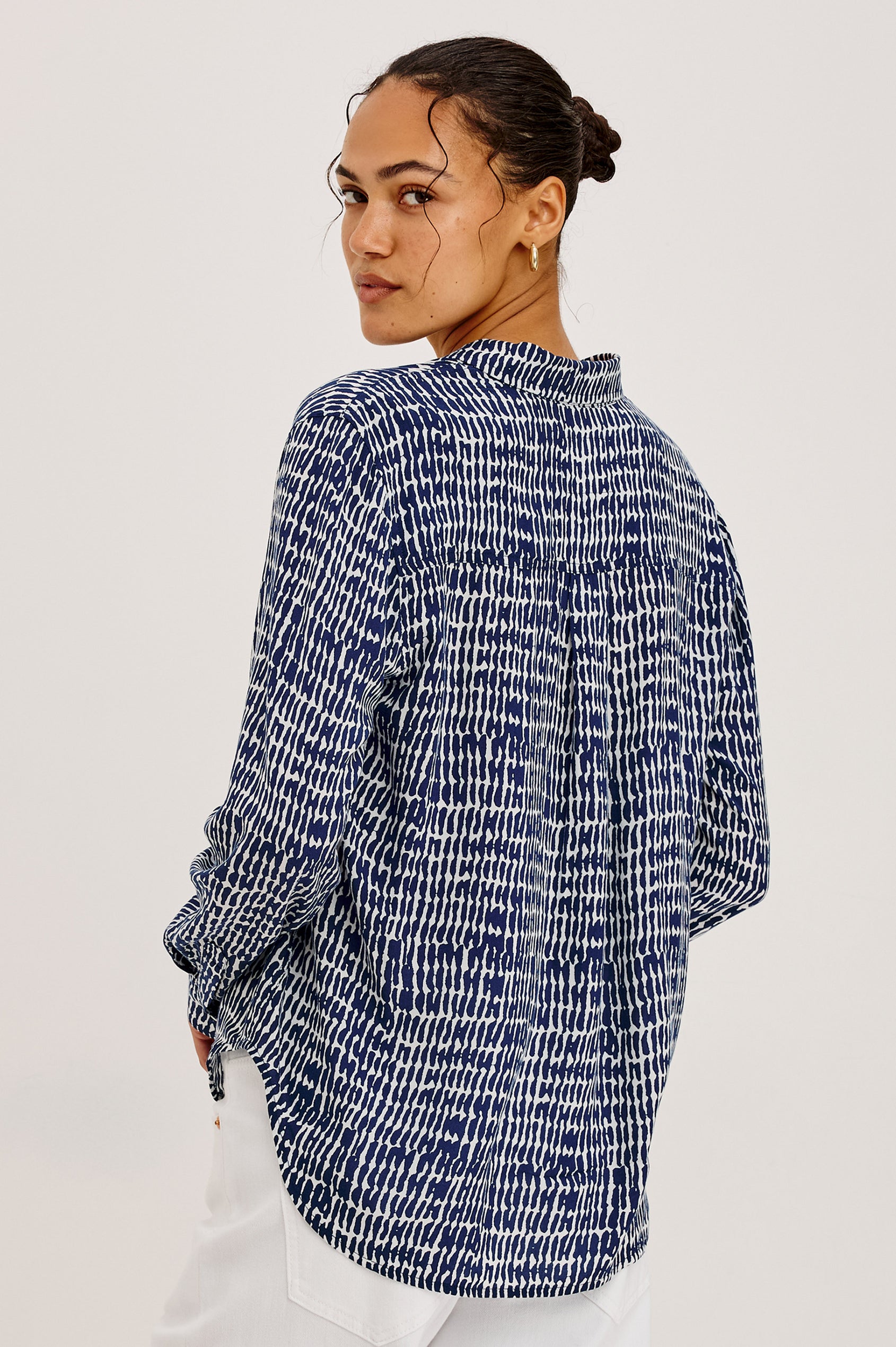 Josephine Button-Up Shirt in Feather Rayon With Collar, Long Sleeves, Relaxed Fit, And Chest Pocket in Navy Pebbled Colorway - Upper Body Back View Featured on Model