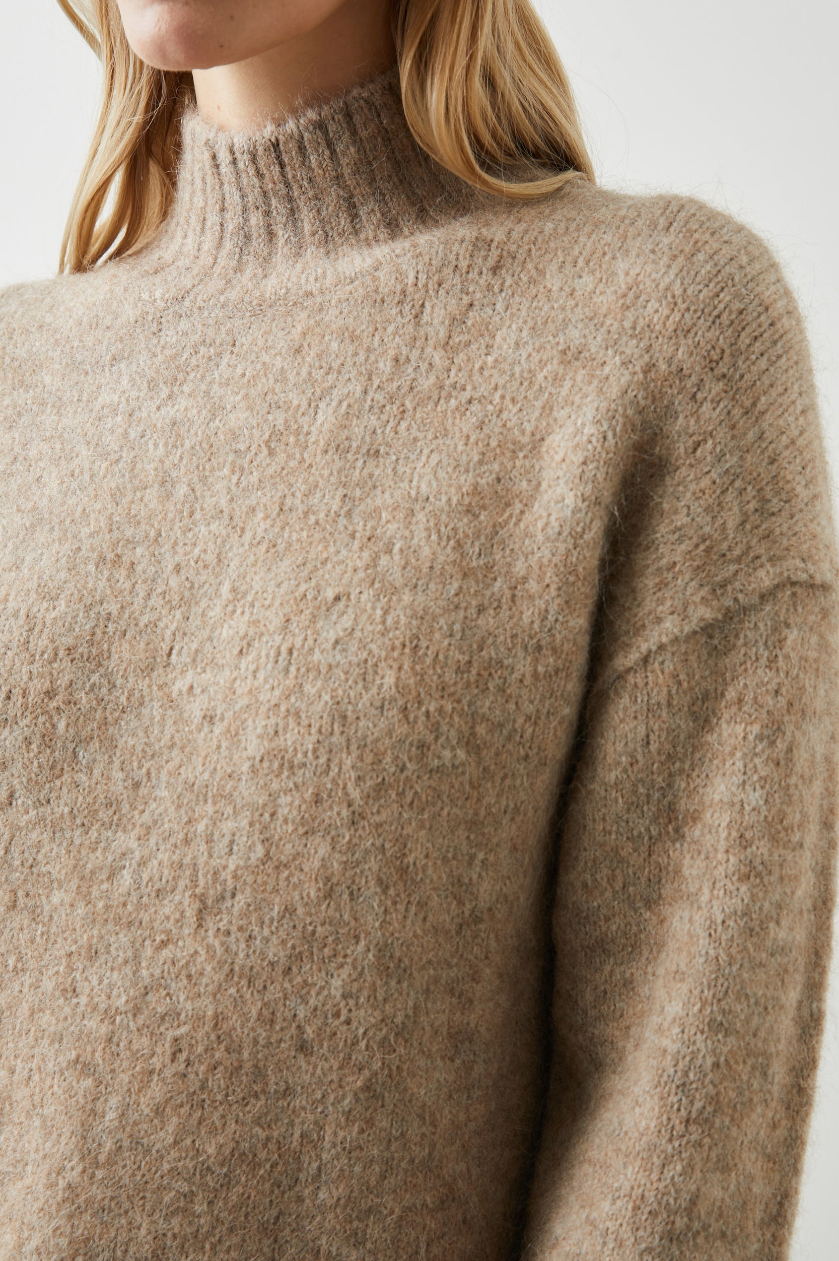 Kacia Long-Sleeve Sweater with a Mock Neck and Ribbed Trim in Oatmeal Colorway - Front View Featured on Model 