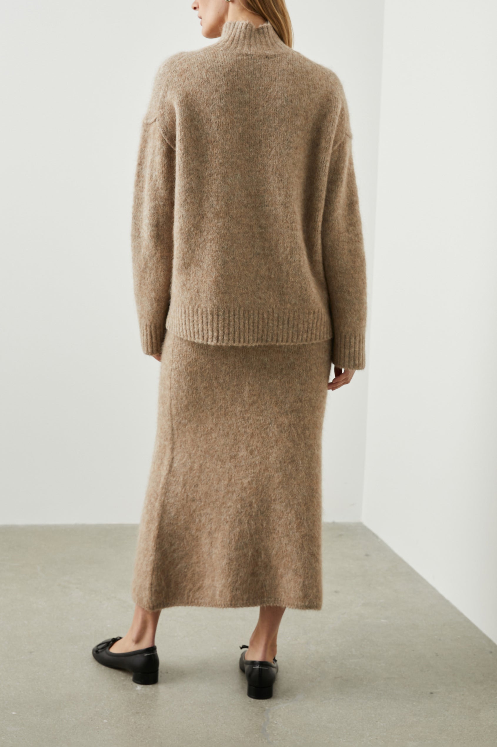 Kacia Long-Sleeve Sweater with a Mock Neck and Ribbed Trim in Oatmeal Colorway - Back Full Body View Featured on Model 