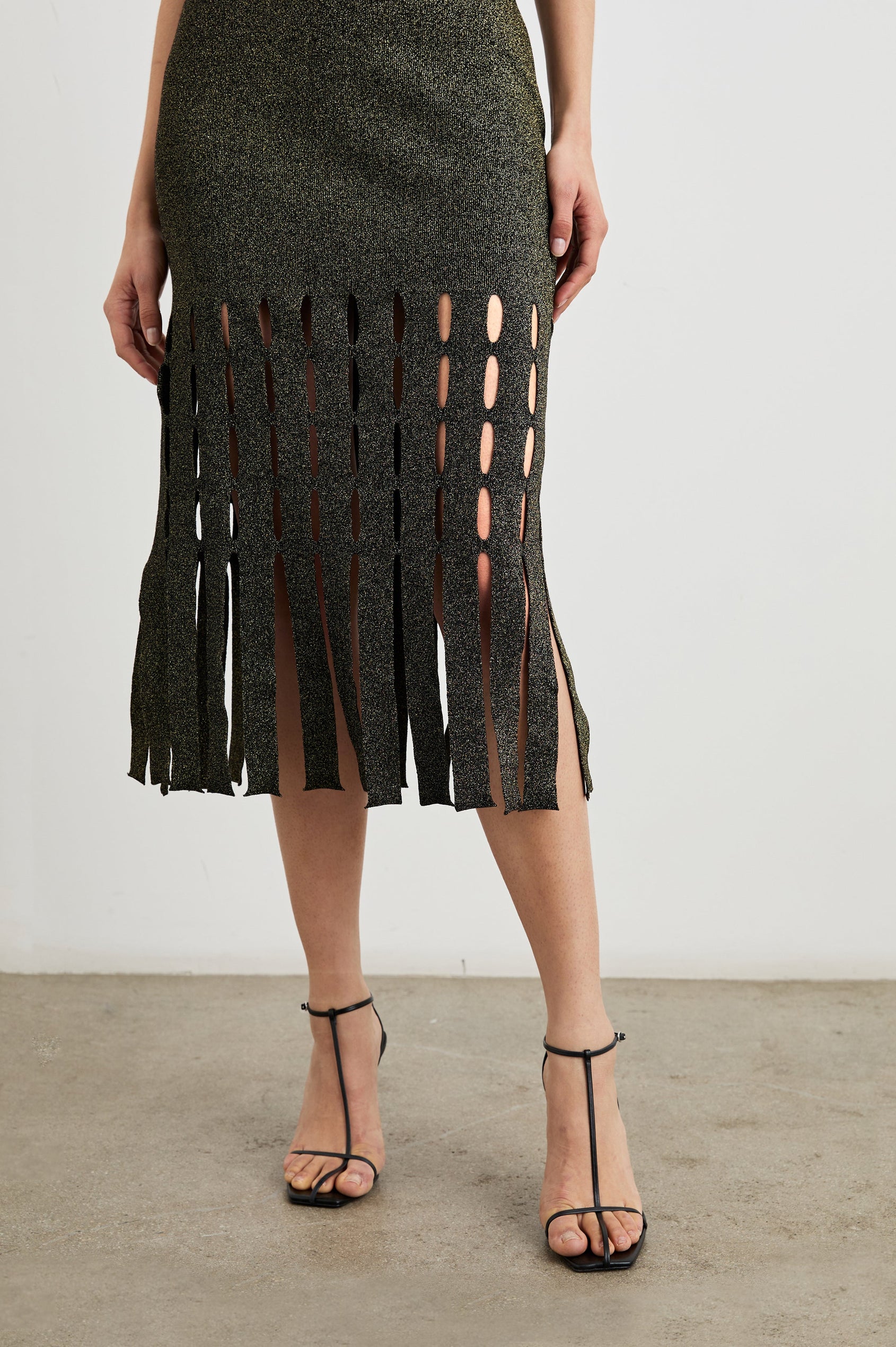 Kaia Sleeveless Midi Dress with a V Neck and Vertical Dashed Cutouts From the Thigh Downward, ending in Panels in Gold Lurex Colorway - Front View Featured on Model