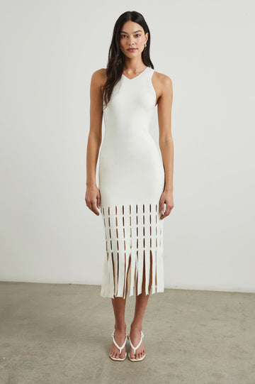 Kaia Sleeveless Midi Dress with a V Neck and Vertical Dashed Cutouts From the Thigh Downward, ending in Panels in White Colorway - Front Full Body View Featured on Model