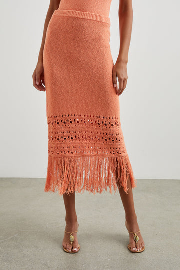 Kaja Midi Skirt with a Crochet Design Along the Bottom and Fringe at the Hem in Persimmon Colorway - Front View Featured on Model  