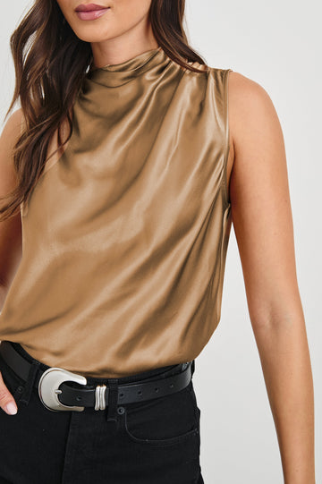 Kaleen Sleeveless Top with Mock Neck with Buttons and Keyhole on the Back and Draped Fabric on the Upper Chest in Camel Colorway - Front Tucked View Featured on Model