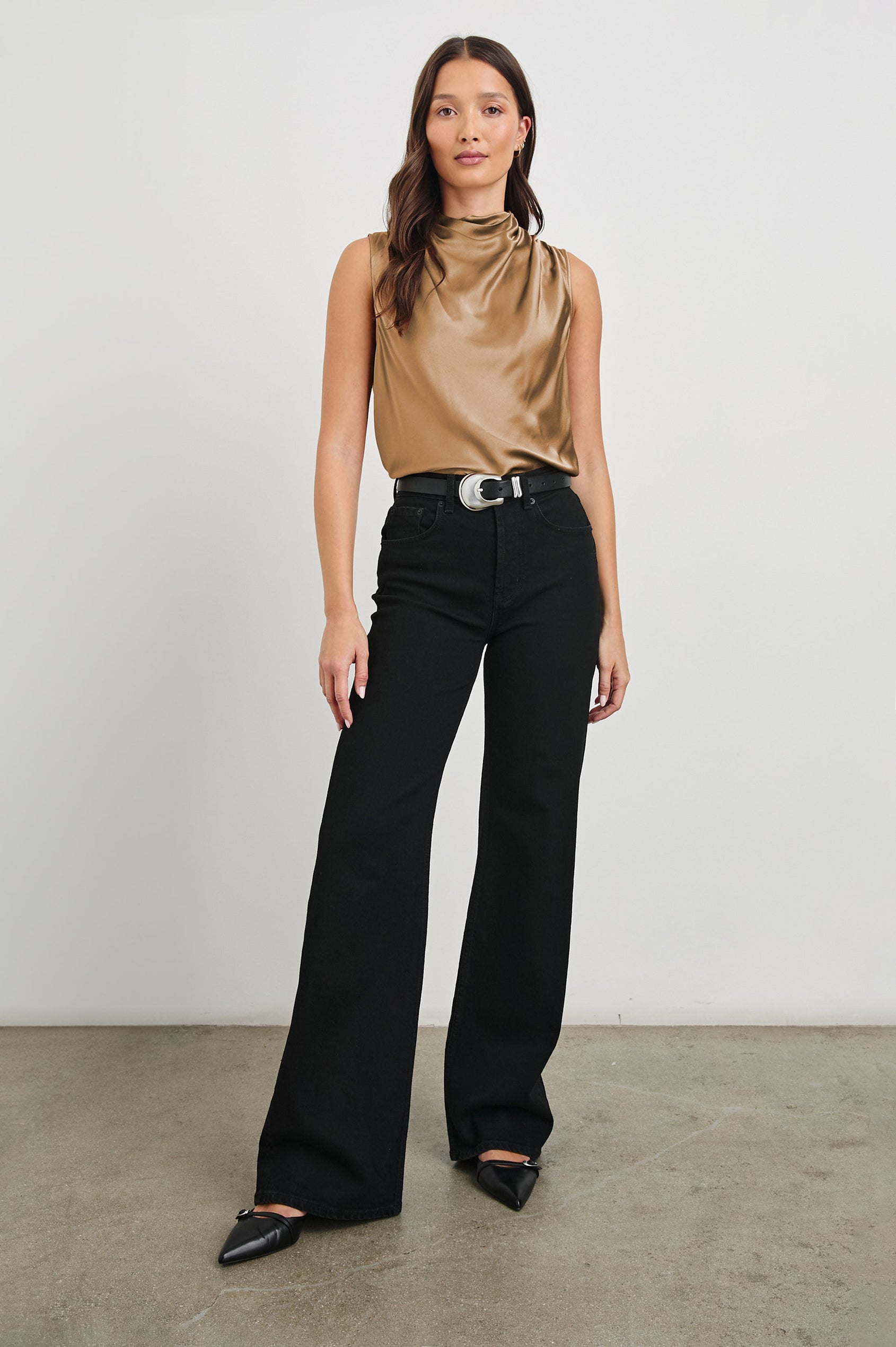 Kaleen Sleeveless Top with Mock Neck with Buttons and Keyhole on the Back and Draped Fabric on the Upper Chest in Camel Colorway - Front Tucked Full Body View Featured on Model