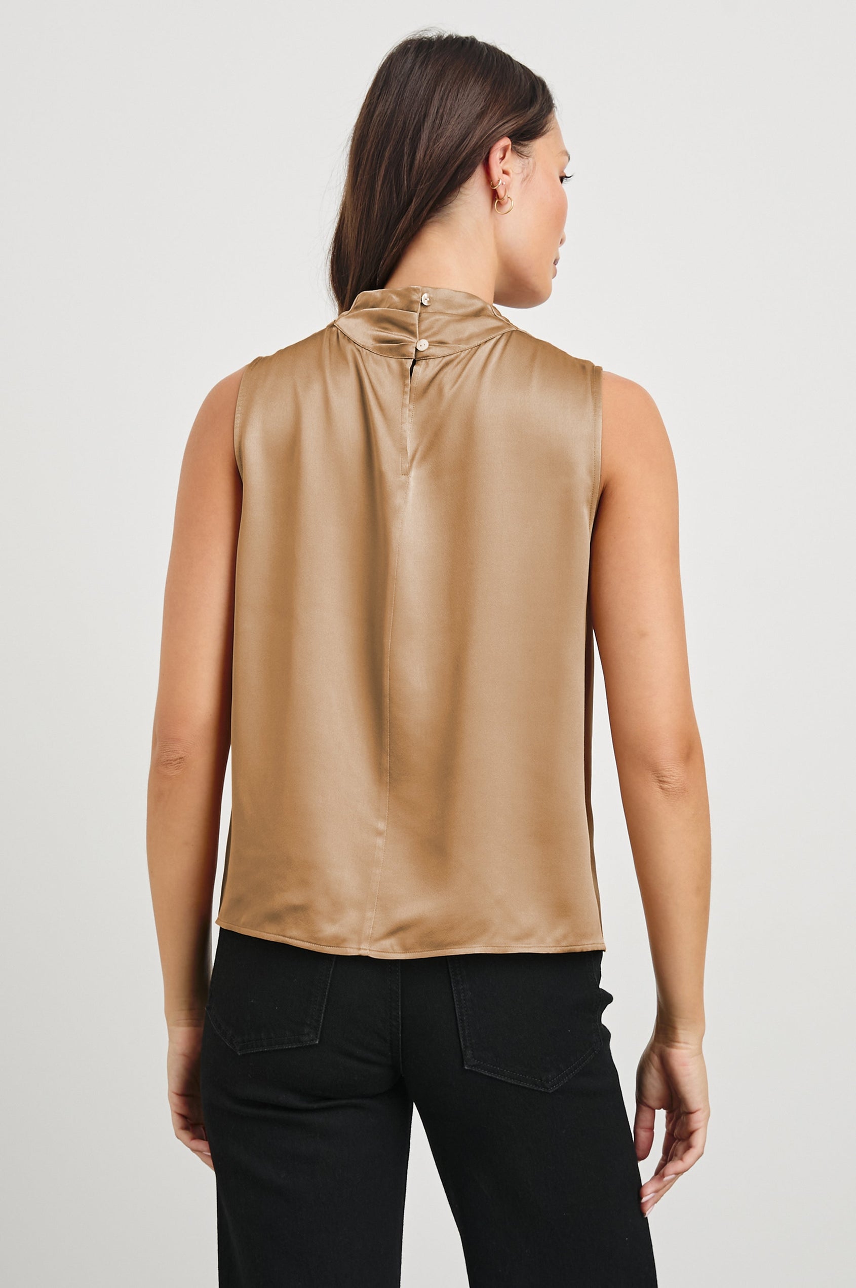 Kaleen Sleeveless Top with Mock Neck with Buttons and Keyhole on the Back and Draped Fabric on the Upper Chest in Camel Colorway - Back View Featured on Model