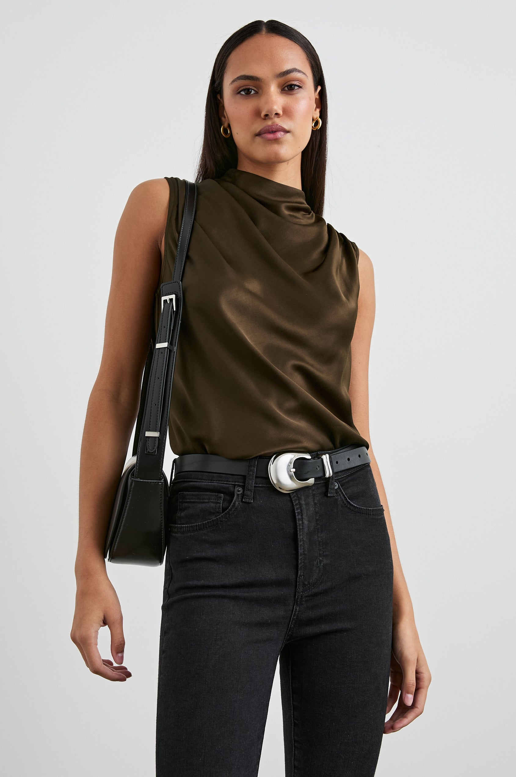 Kaleen Sleeveless Top with Mock Neck with Buttons and Keyhole on the Back and Draped Fabric on the Upper Chest in Dark Moss Colorway- Front Tucked View Featured on Model