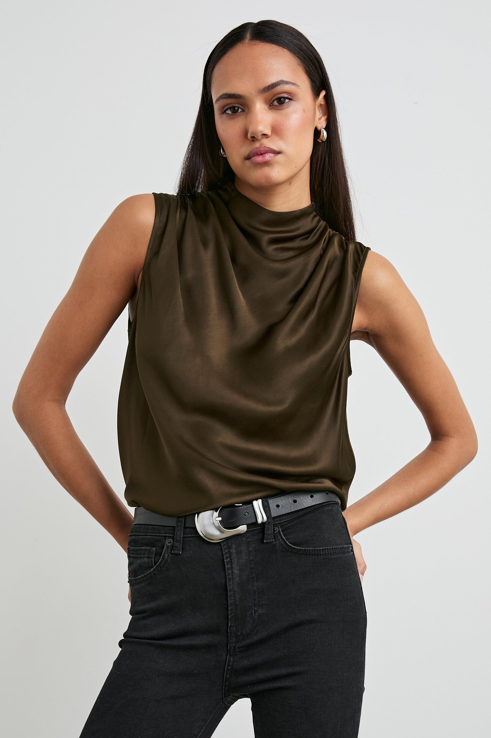 Kaleen Sleeveless Top with Mock Neck with Buttons and Keyhole on the Back and Draped Fabric on the Upper Chest in Dark Moss Colorway- Front Tucked View Featured on Model