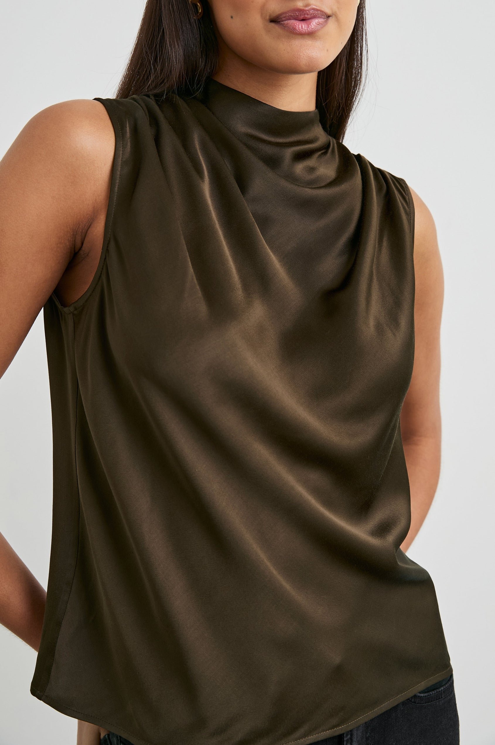 Kaleen Sleeveless Top with Mock Neck with Buttons and Keyhole on the Back and Draped Fabric on the Upper Chest in Dark Moss Colorway- Front View Featured on Model