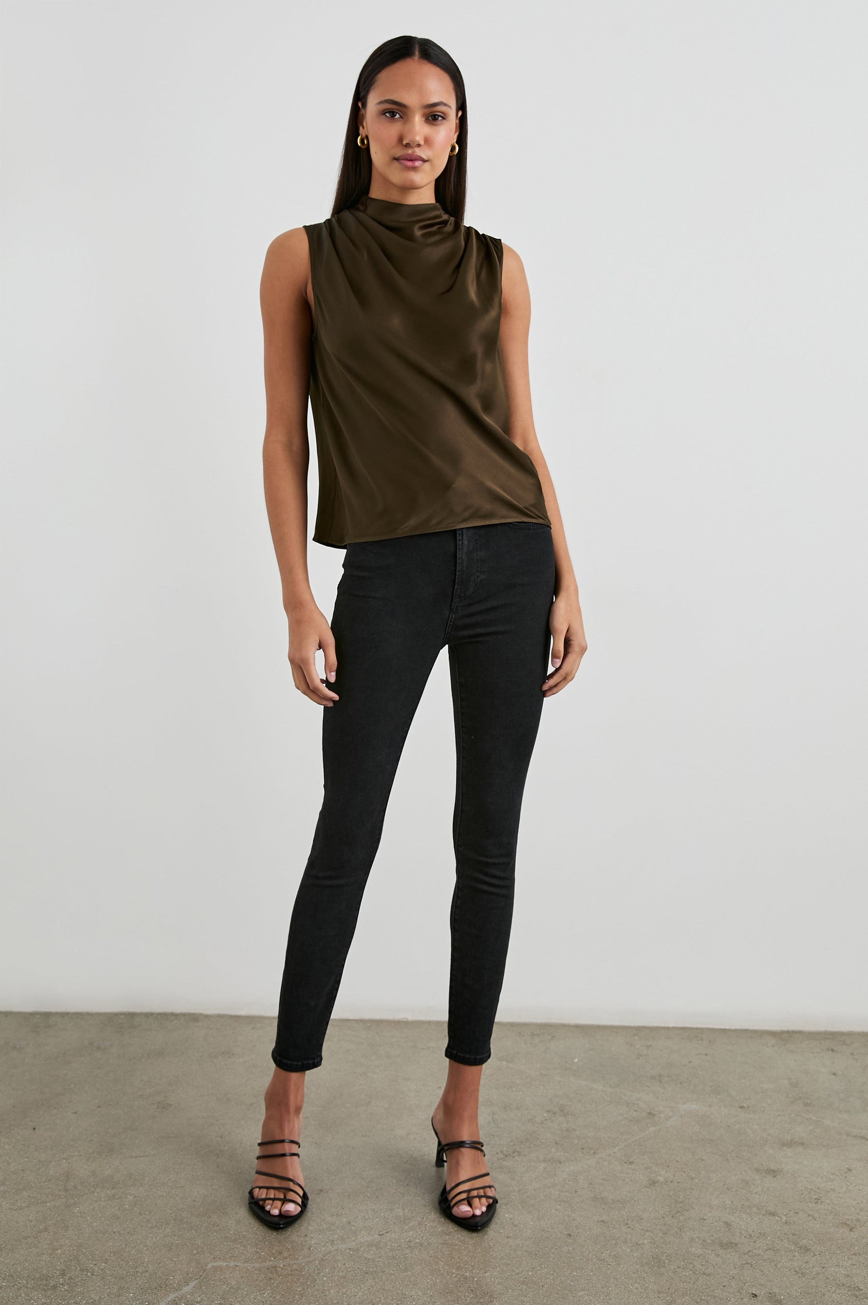 Kaleen Sleeveless Top with Mock Neck with Buttons and Keyhole on the Back and Draped Fabric on the Upper Chest in Dark Moss Colorway- Front View Featured on Model