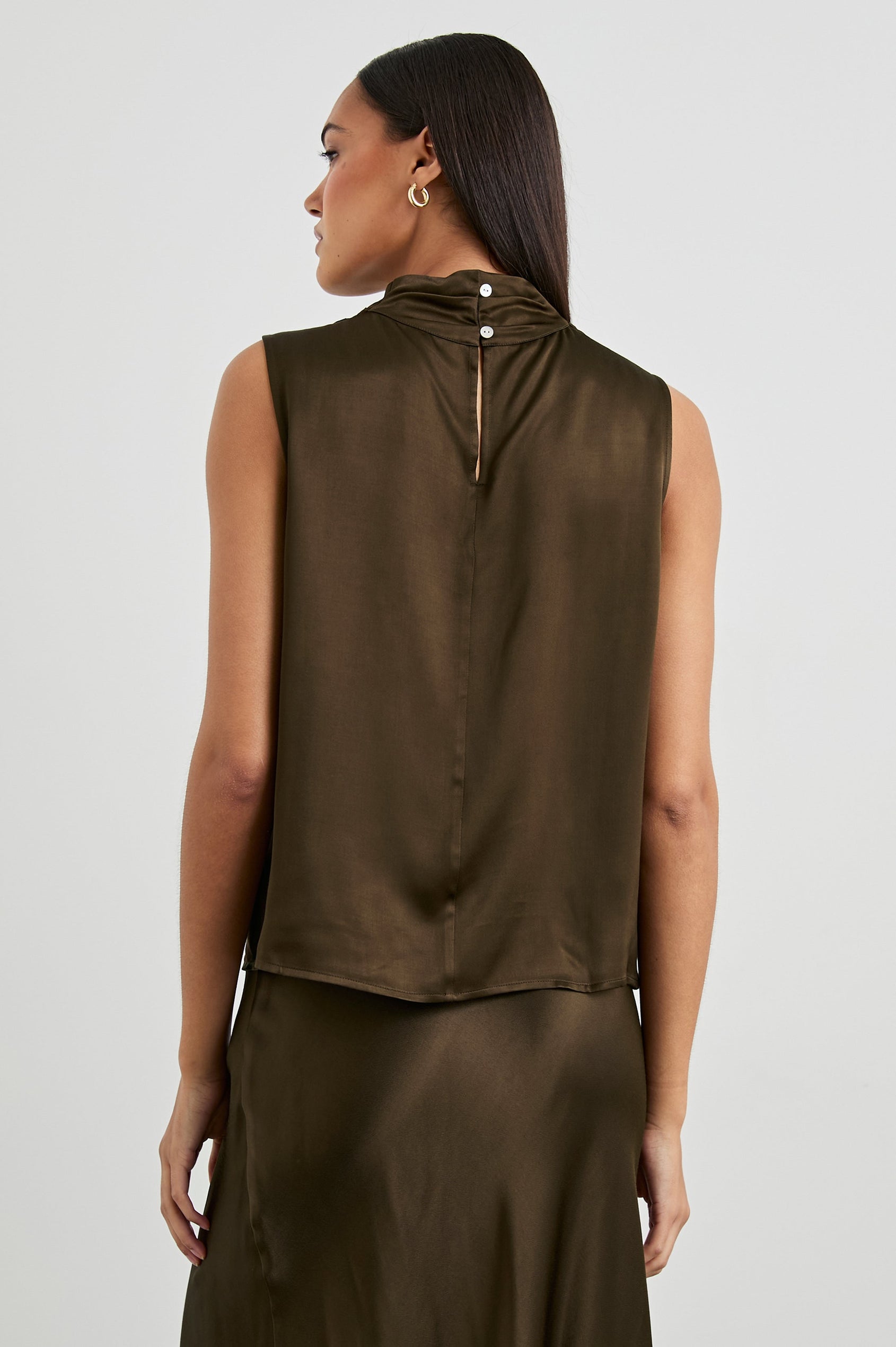 Kaleen Sleeveless Top with Mock Neck with Buttons and Keyhole on the Back and Draped Fabric on the Upper Chest in Dark Moss Colorway- Back View Featured on Model
