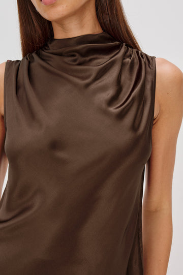 Kaleen Sleeveless Top with Mock Neck with Buttons and Keyhole on the Back and Draped Fabric on the Upper Chest in Espresso Colorway - Close up of Details on Model