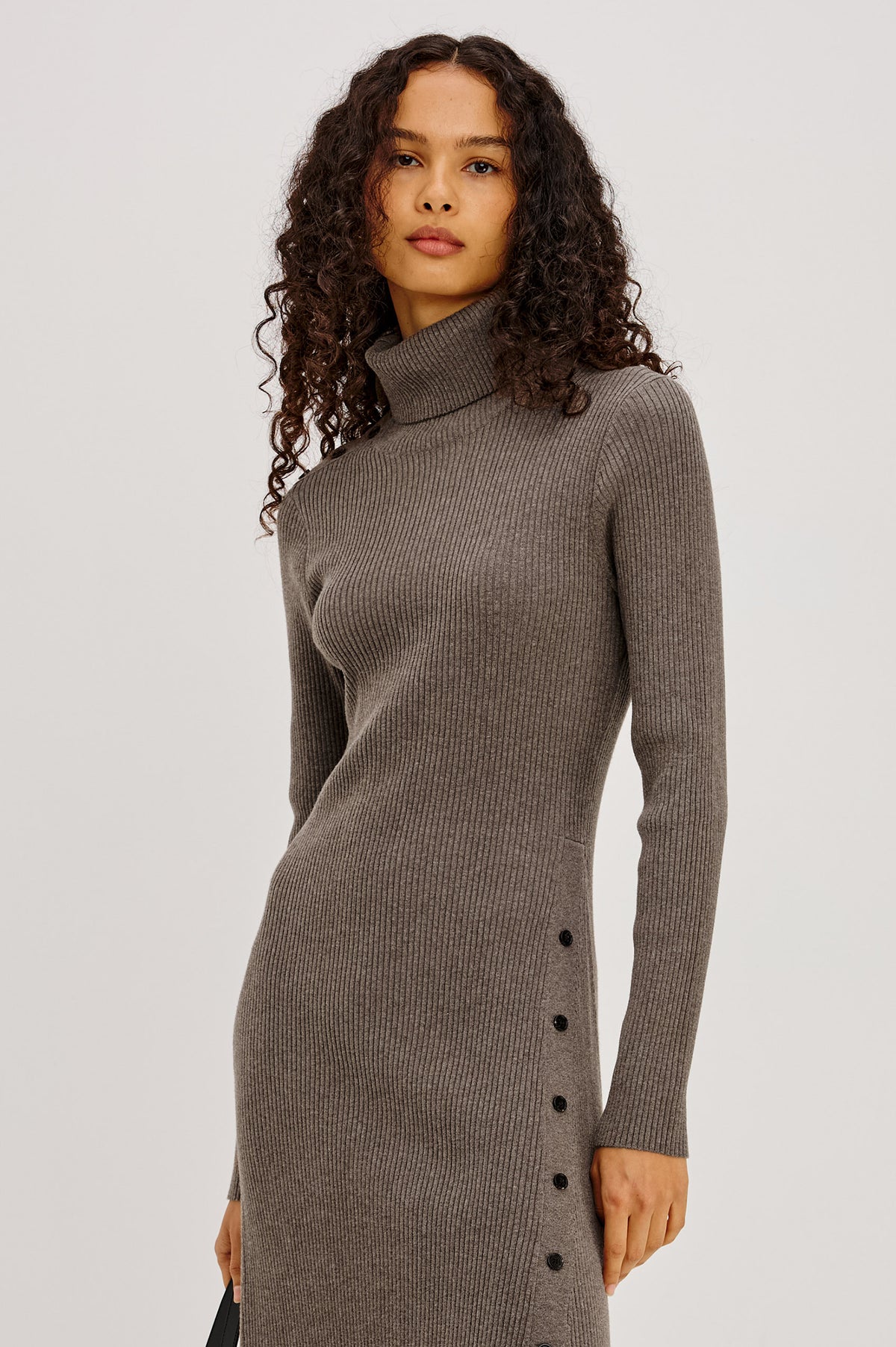 Kat Maxi Dress in Ribbed Cotton Blend With Foldover Turtleneck Button Neckline, Long Sleeves, Fitted Silhouette, Long Sleeves, Side Placket, and Subtle Flare at Hem in Hazelnut Colorway - Upper Body Front View Featured on Model
