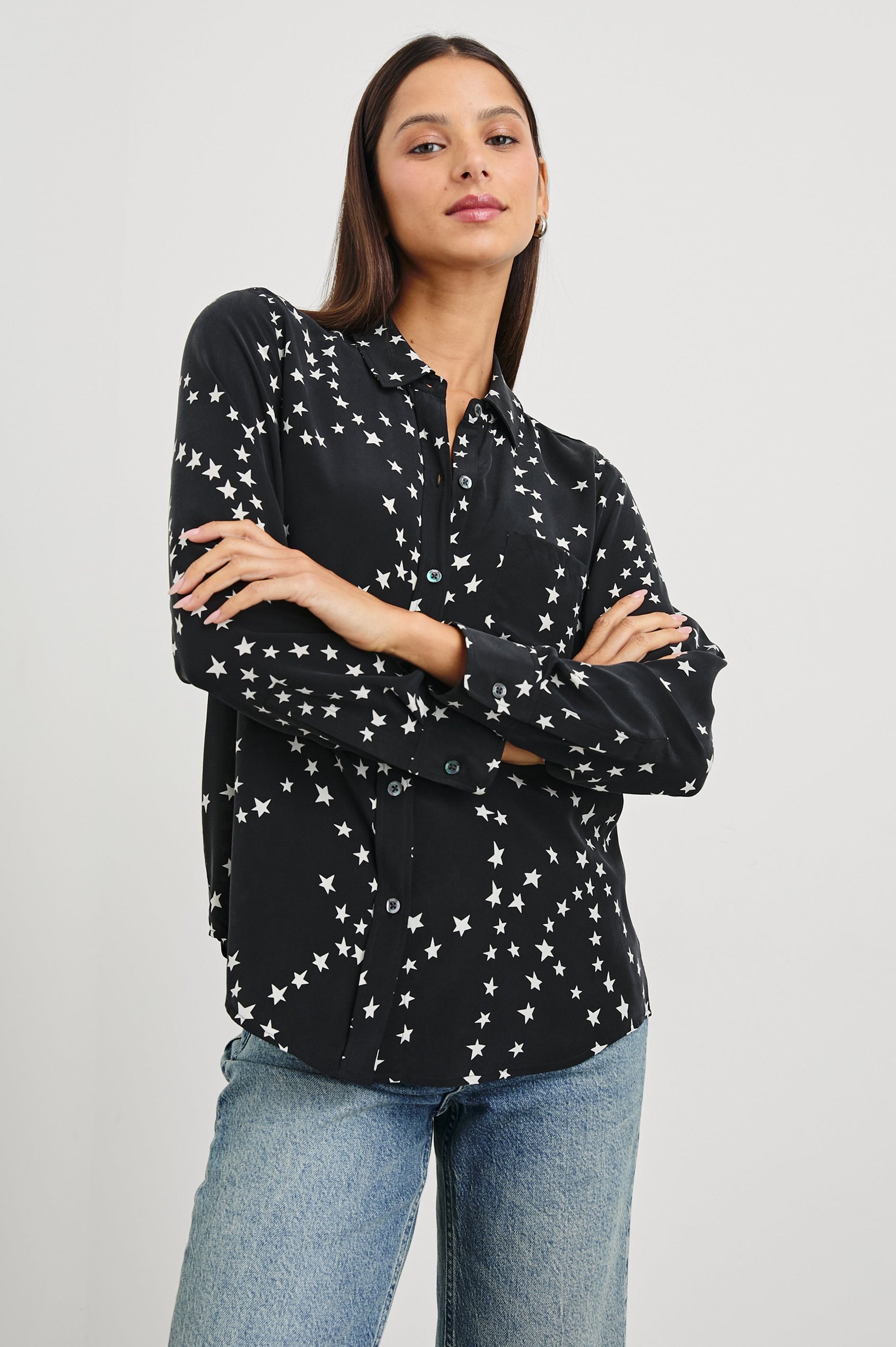 Kate Long Sleeve Button up with a Chest Patch Pocket in Black Star Chain Colorway, White Stars on Black - Front View Featured on Model