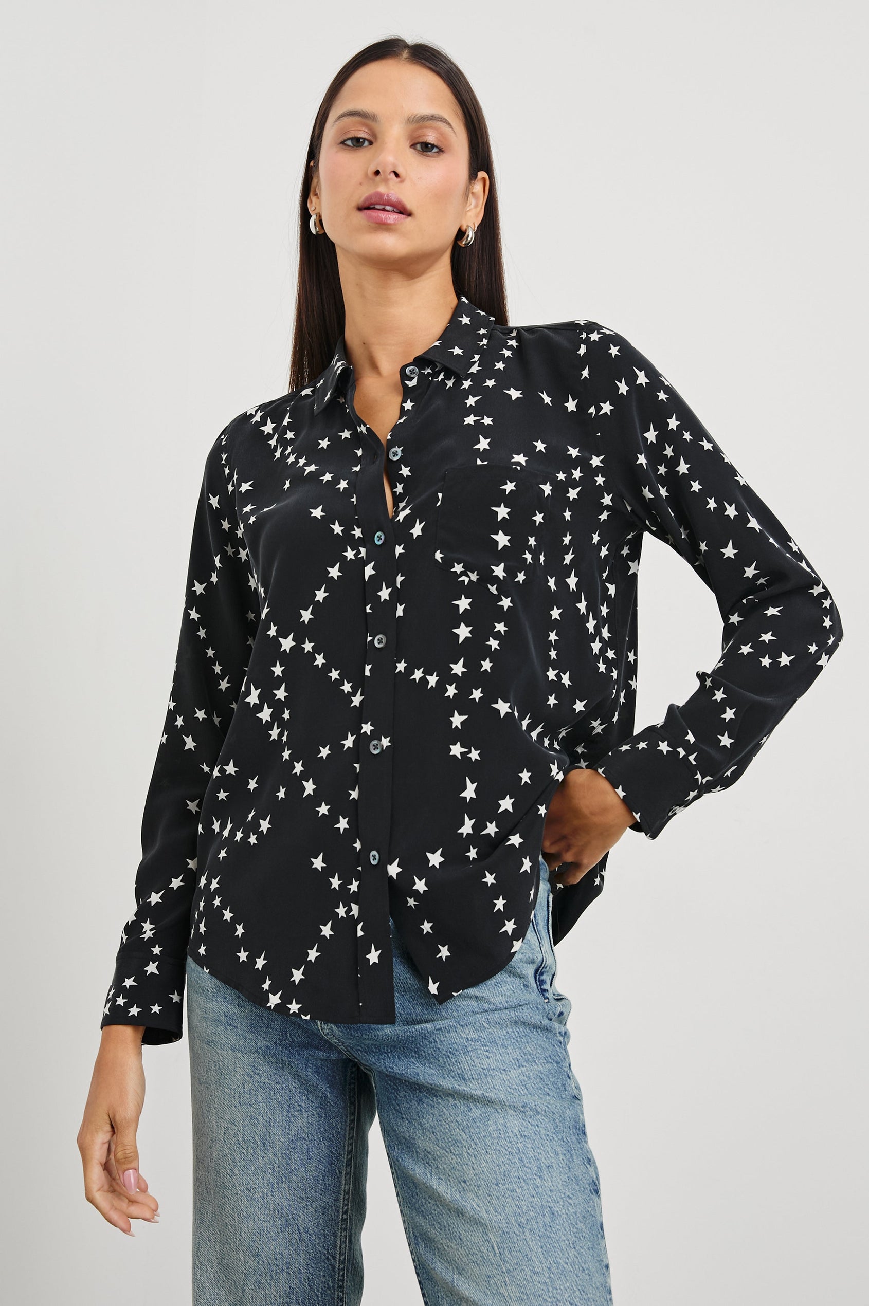 Kate Long Sleeve Button up with a Chest Patch Pocket in Black Star Chain Colorway, White Stars on Black - Front View Featured on Model