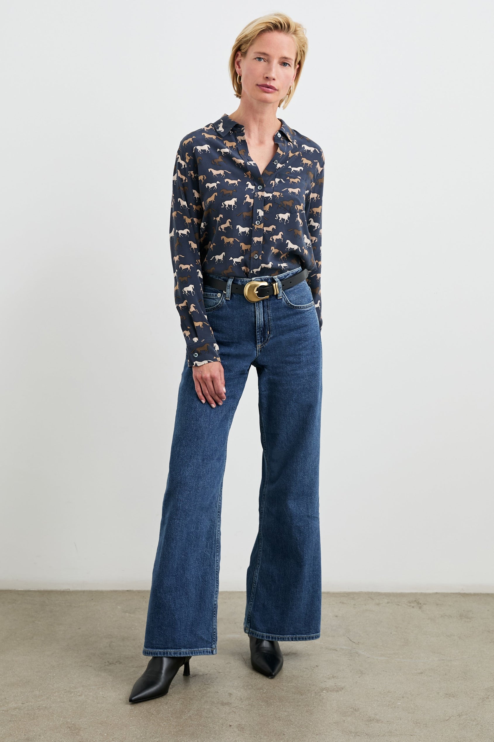 Kate Long Sleeve Button up with a Chest Patch Pocket in Horses Colorway, Horses in browns and white on Navy - Front Tucked Full Body View Featured on Model