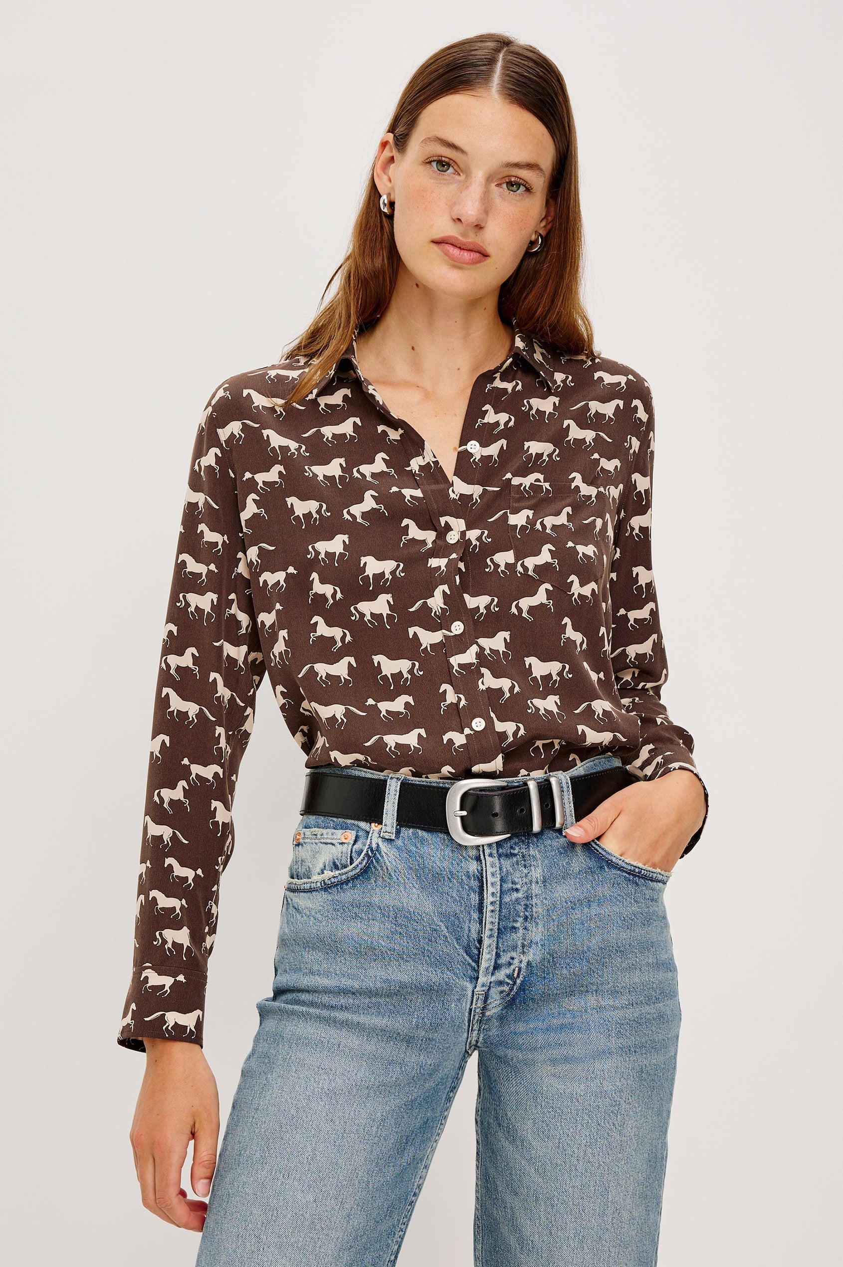 Washed silk button-down shirt in ivory with a horse print. The shirt has a soft drape and classic collar for a polished look. Front View on Model.