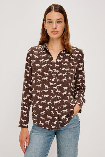 Washed silk button-down shirt in ivory with a horse print. The shirt has a soft drape and classic collar for a polished look. Front View on Model.