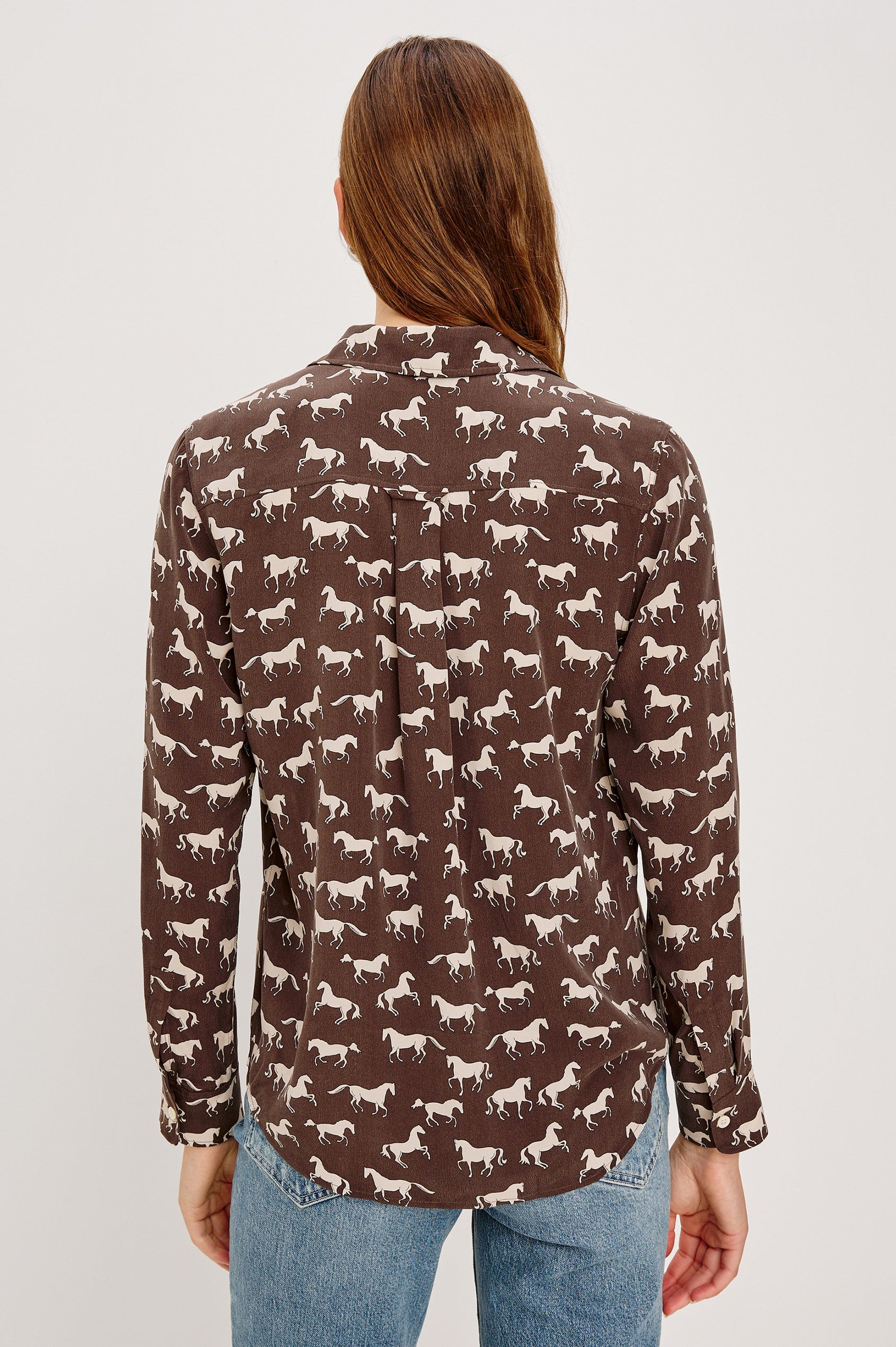 Washed silk button-down shirt in ivory with a horse print. The shirt has a soft drape and classic collar for a polished look. Back View on Model.