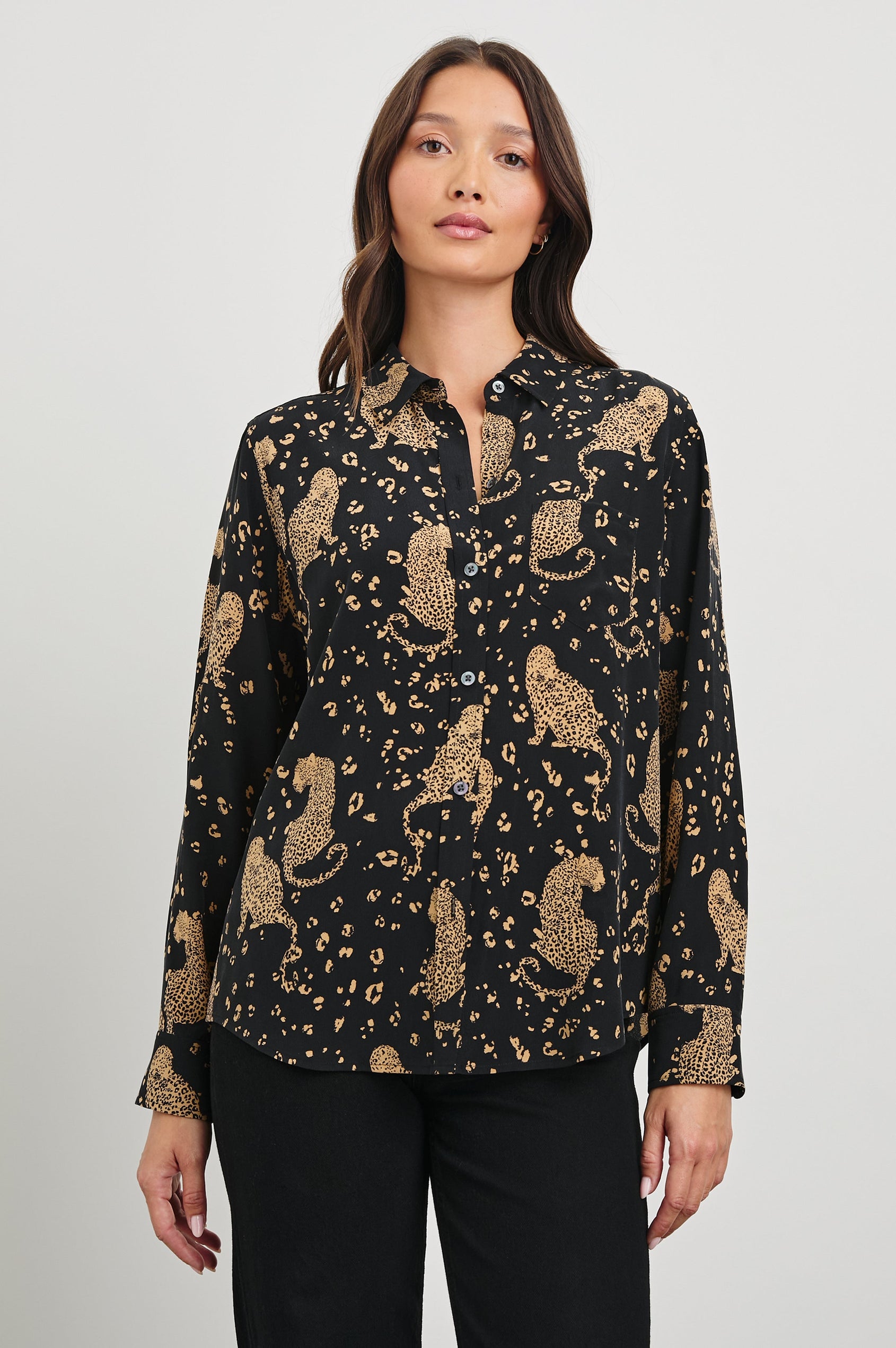 Kate Long Sleeve Button up with a Chest Patch Pocket in Noir Leopard Colorway, gold leopards and spots on Black - Front View Featured on Model