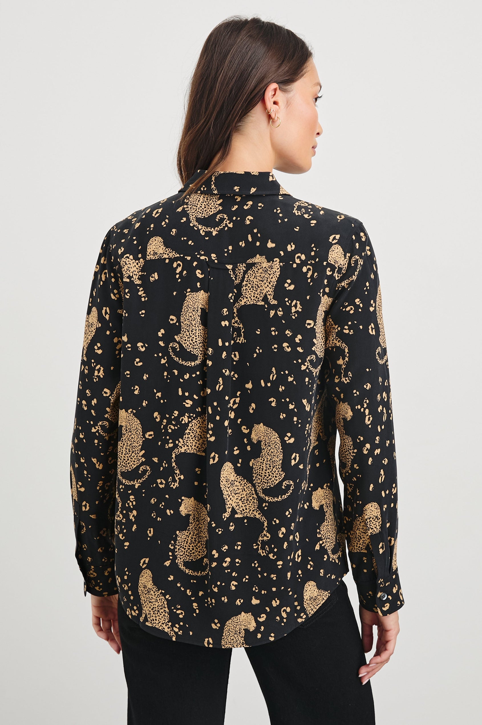 Kate Long Sleeve Button up with a Chest Patch Pocket in Noir Leopard Colorway, gold leopards and spots on Black - Back View Featured on Model
