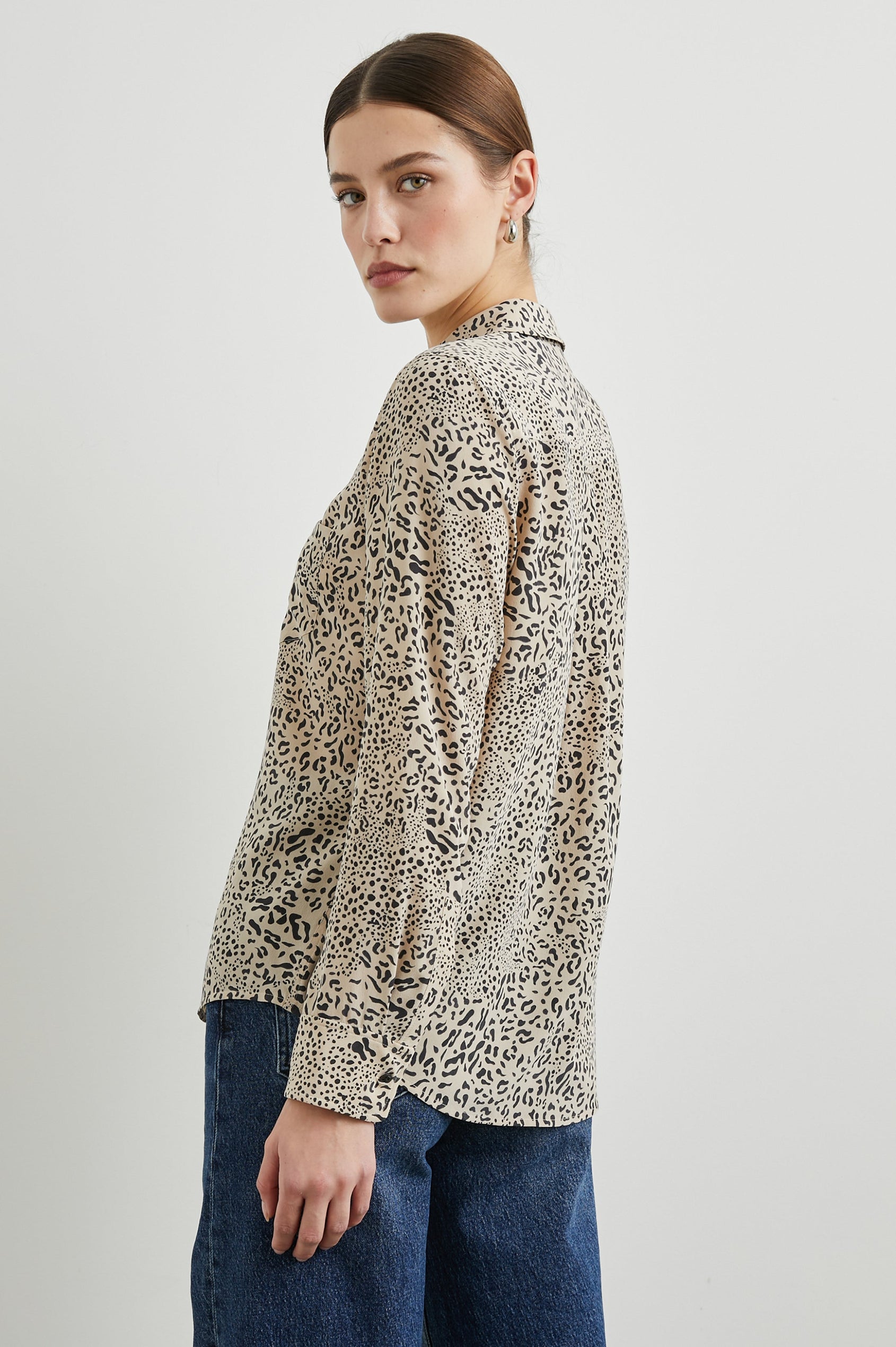 Kate Long Sleeve Button up with a Chest Patch Pocket in Sand Mixed Cheetah Colorway, Black Cheetah Spots on Sand - Back View Featured on Model