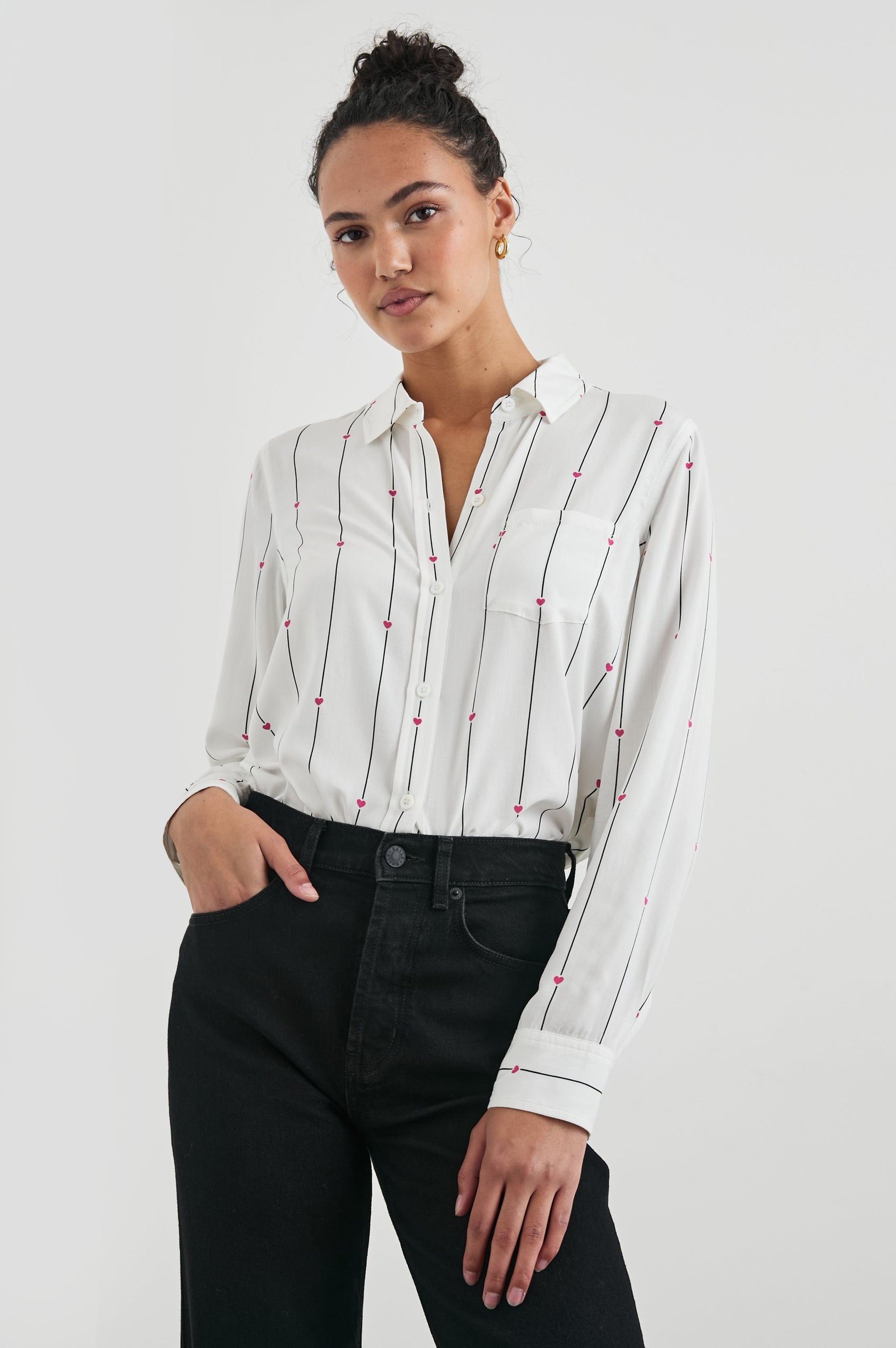 Kathryn Long-Sleeve Button up with a Chest Patch Pocket in Striped Hearts Colorway, with vertical blue stripes dashed with pink hearts on ivory - Front View Featured on Model