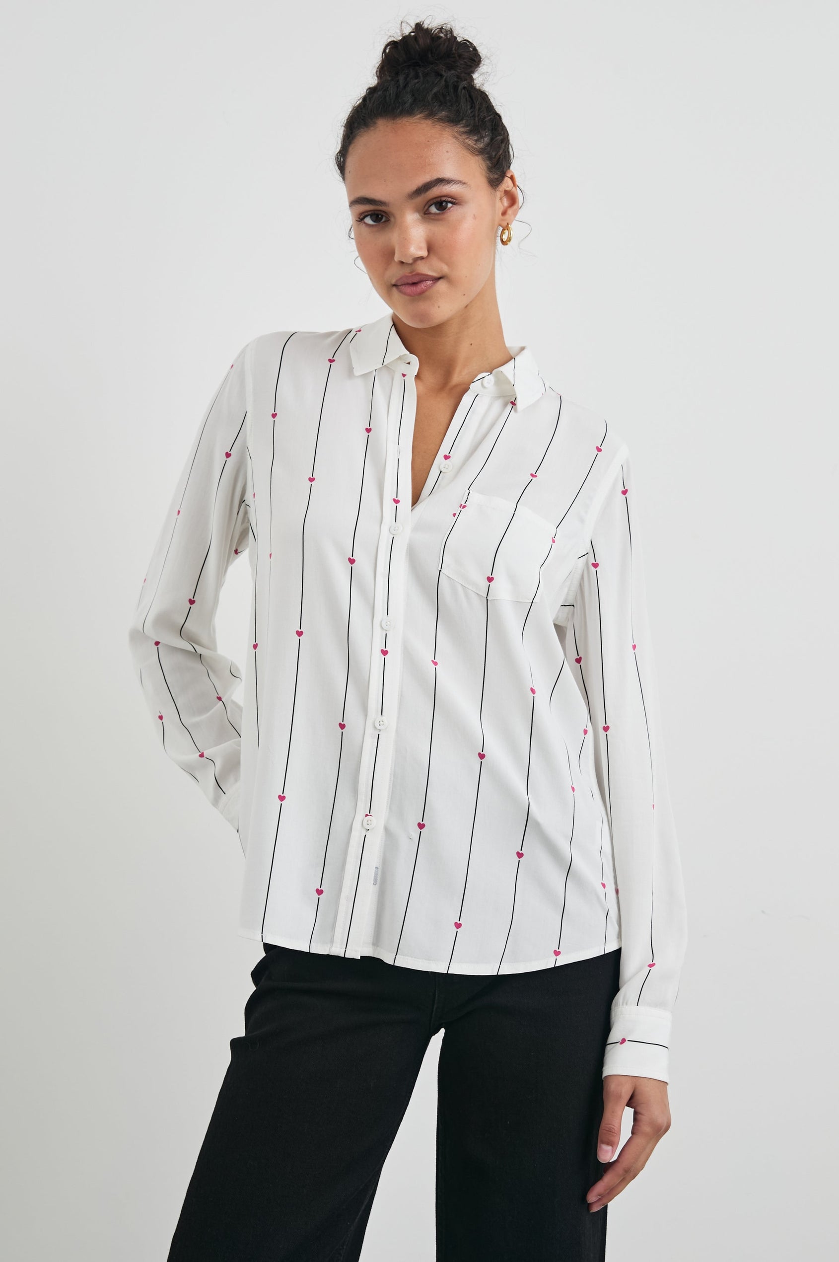 Kathryn Long-Sleeve Button up with a Chest Patch Pocket in Striped Hearts Colorway, with vertical blue stripes dashed with pink hearts on ivory - Front View Featured on Model