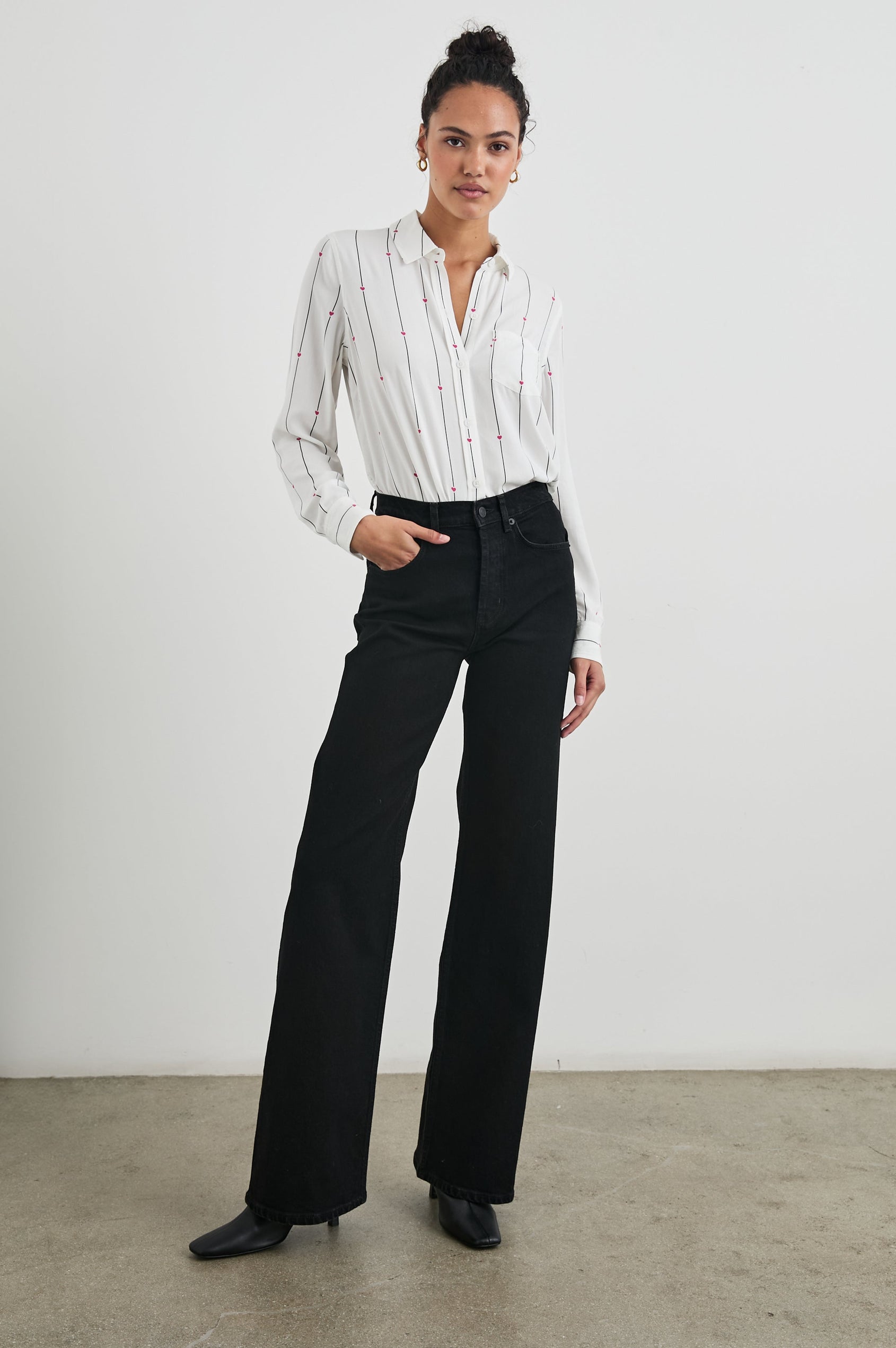 Kathryn Long-Sleeve Button up with a Chest Patch Pocket in Striped Hearts Colorway, with vertical blue stripes dashed with pink hearts on ivory - Front Full Body View Featured on Model