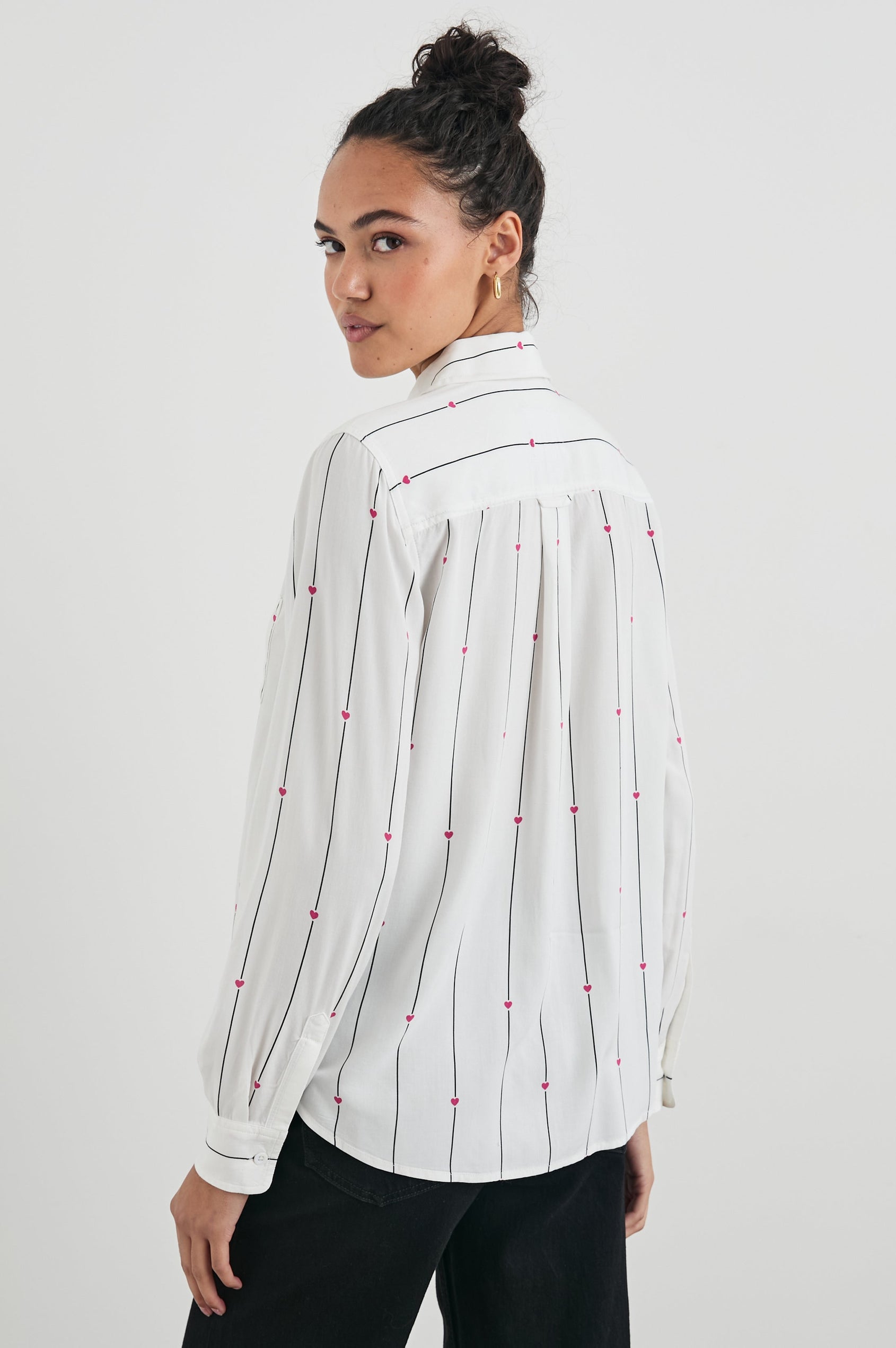 Kathryn Long-Sleeve Button up with a Chest Patch Pocket in Striped Hearts Colorway, with vertical blue stripes dashed with pink hearts on ivory - Back View Featured on Model