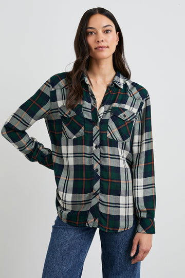 Kendra Long-Sleeve Button Up with Two Chest Button Flap Pockets in Forest Navy Stone Colorway, a Plaid with an Interior Black and White Plaid - Front  View Featured on Model