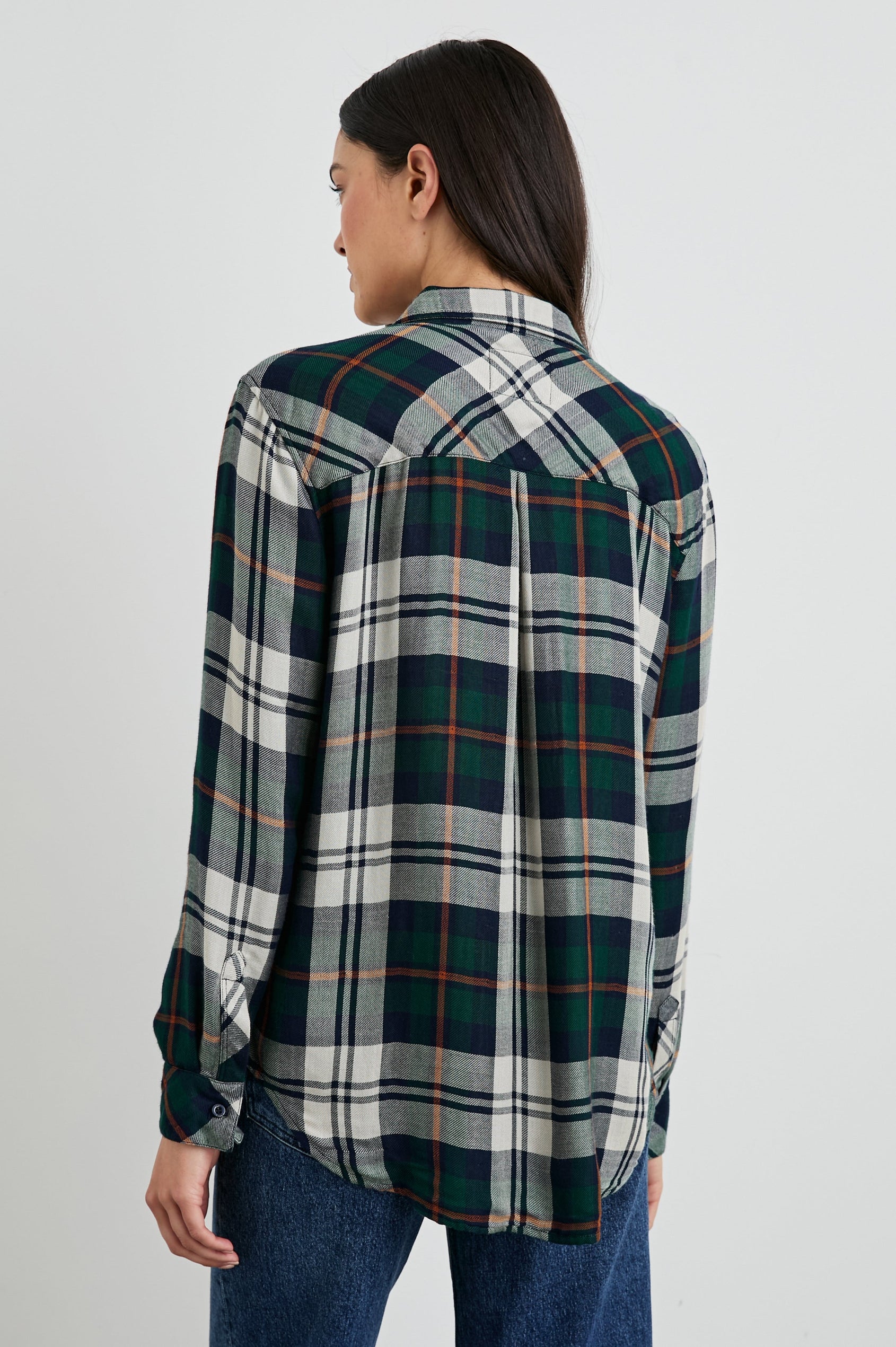Kendra Long-Sleeve Button Up with Two Chest Button Flap Pockets in Forest Navy Stone Colorway, a Plaid with an Interior Black and White Plaid - Back View Featured on Model