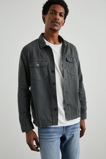 Kerouac Long-Sleeve Shirt Jacket with Button Closure and Two Button Chest Flap Pockets in Charcoal Colorway  - Front Unbuttoned View Featured on Model