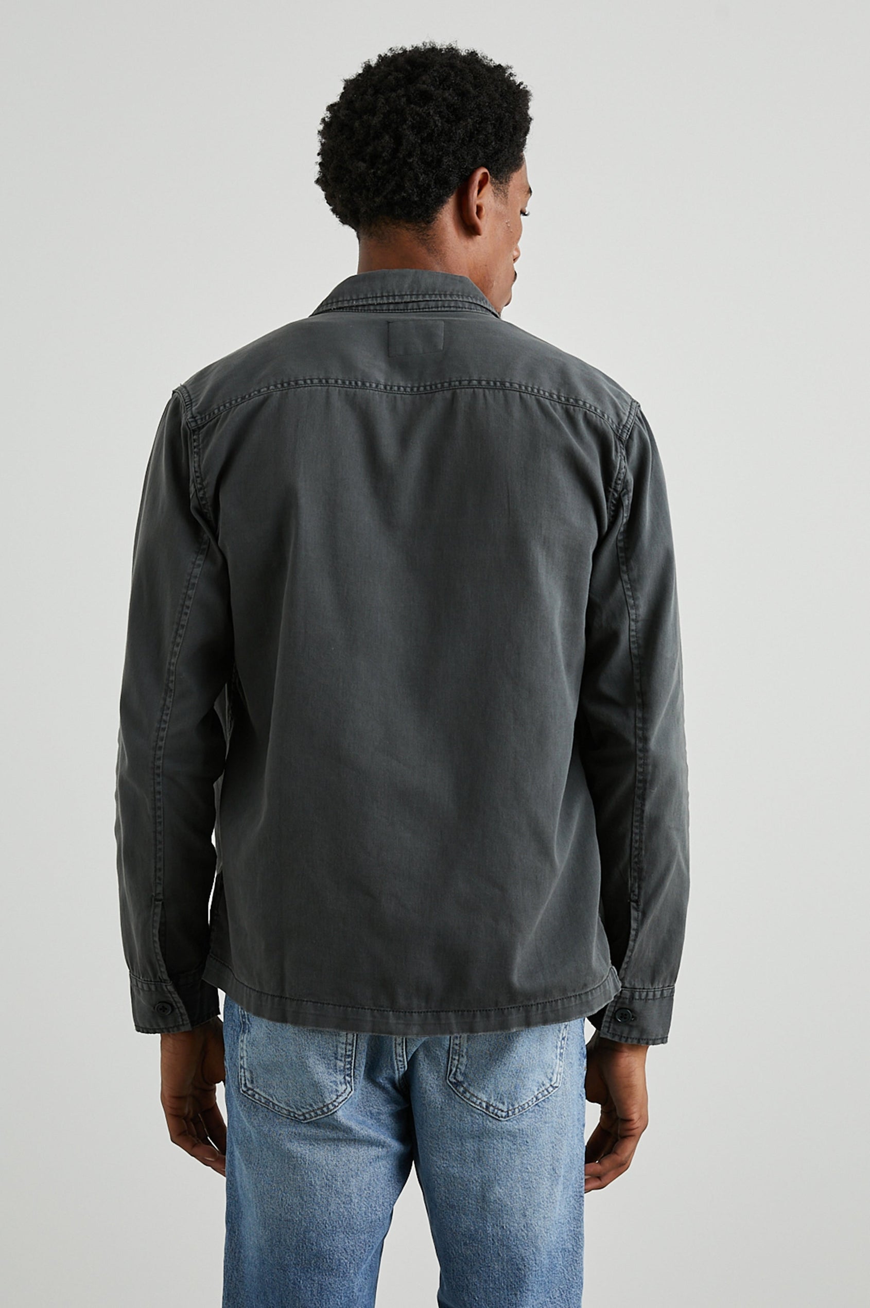 Kerouac Long-Sleeve Shirt Jacket with Button Closure and Two Button Chest Flap Pockets in Charcoal Colorway  - Back View Featured on Model