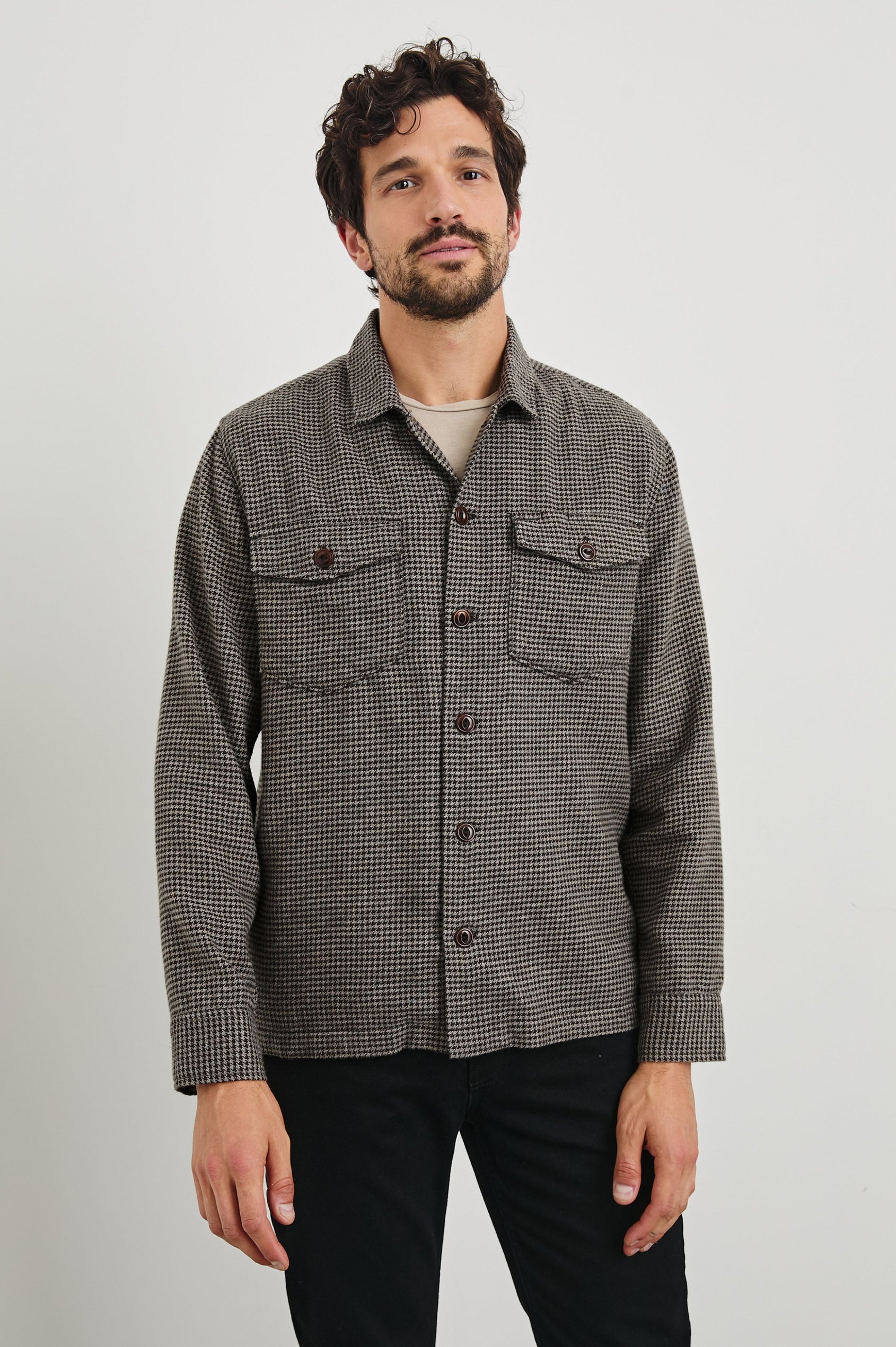 Kerouac Long-Sleeve Shirt Jacket with Button Closure and Two Button Chest Flap Pockets in Mire Colorway, a Tan and Black Houndstooth - Front View Featured on Model