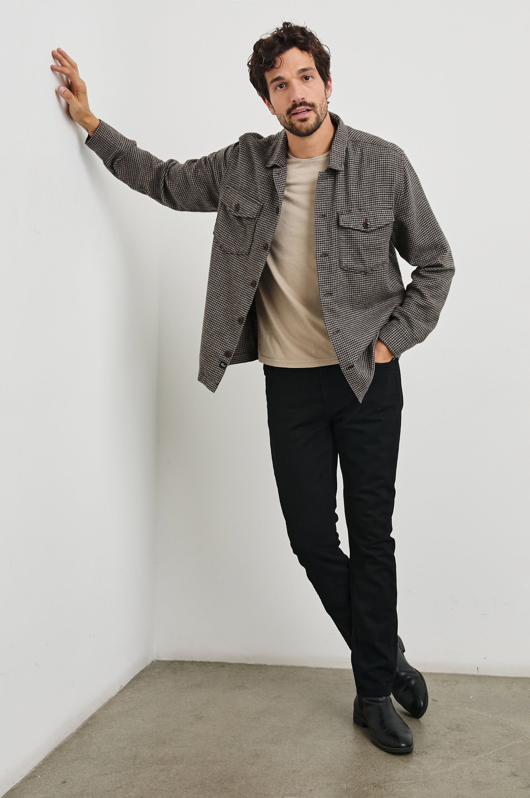 Kerouac Long-Sleeve Shirt Jacket with Button Closure and Two Button Chest Flap Pockets in Mire Colorway, a Tan and Black Houndstooth - Front Full Body View Featured on Model