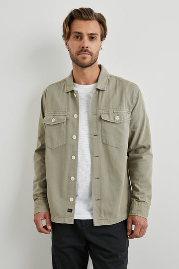 Kerouac Long-Sleeve Shirt Jacket with Button Closure and Two Button Chest Flap Pockets in Natural Colorway  - Front Unbuttoned View Featured on Model