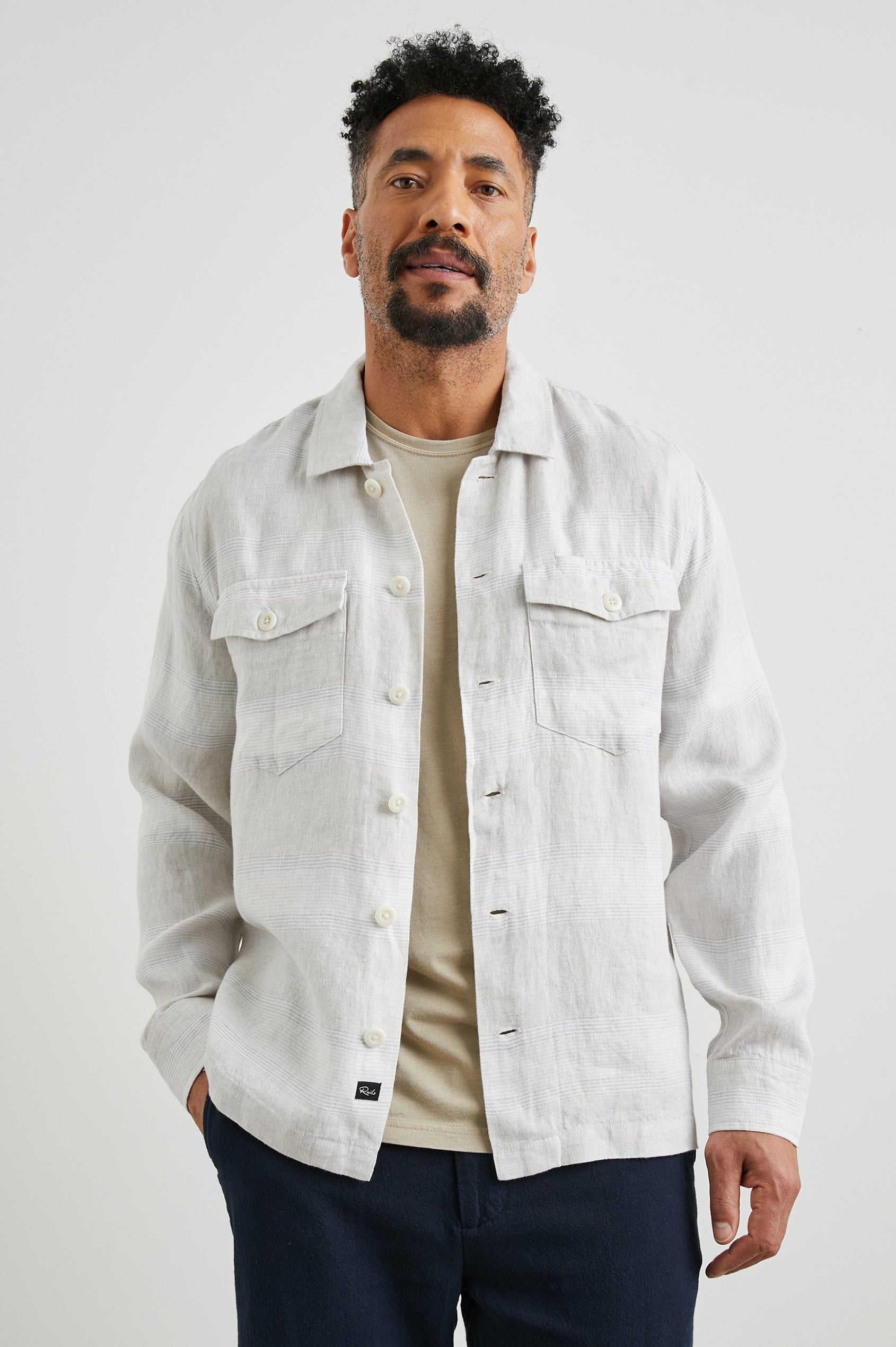 Kerouac Long-Sleeve Shirt Jacket with Button Closure and Two Button Chest Flap Pockets in Wicker Graphite Stripe Colorway, Grey and White Horizontal Stripes on Wicker  - Front Unbuttoned View Featured on Model