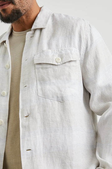 Kerouac Long-Sleeve Shirt Jacket with Button Closure and Two Button Chest Flap Pockets in Wicker Graphite Stripe Colorway, Grey and White Horizontal Stripes on Wicker  - Front Unbuttoned View Featured on Model