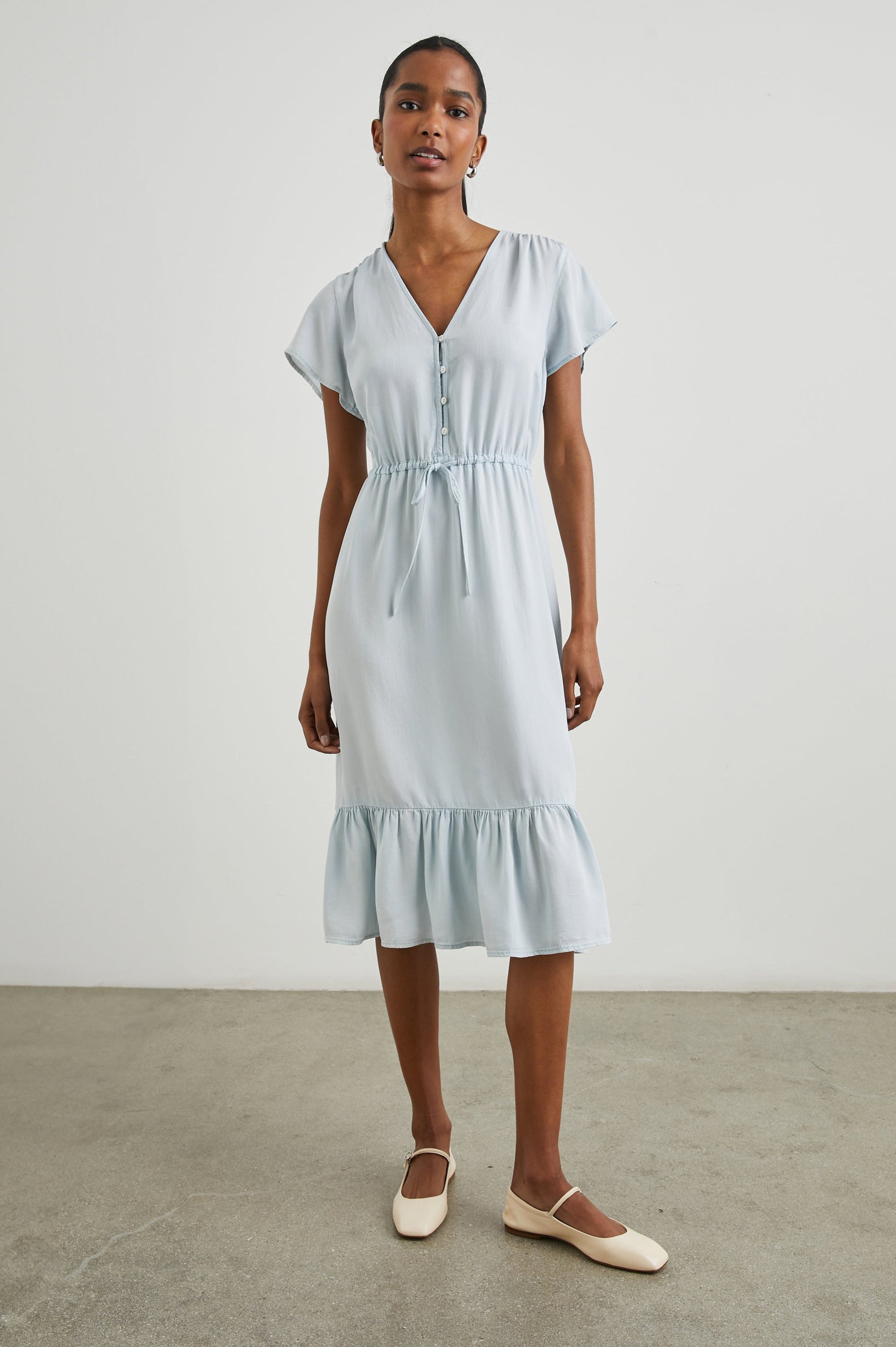 Kiki Short Sleeve Midi Dress with a V Neck, Buttons Down the Front Bodice, a Drawstring Waist and Ruffles at the Hem in Light Vintage Colorway - Front Full Body View Featured on Model 
