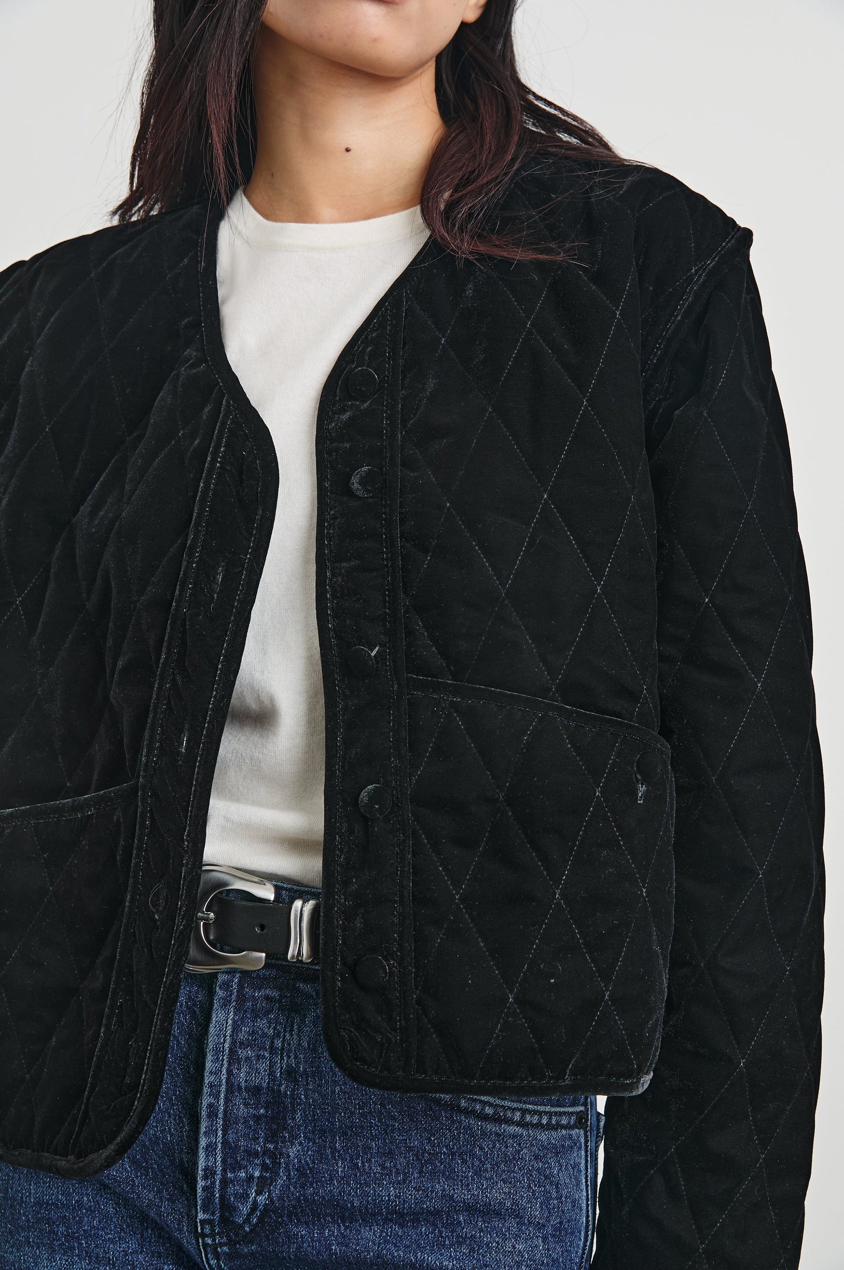 Kiko Jacket with Button Closure, a V Neck, Two Front Patch Pockets and a Quilted Appearance in Black Velvet Colorway - Front View Featured on Model